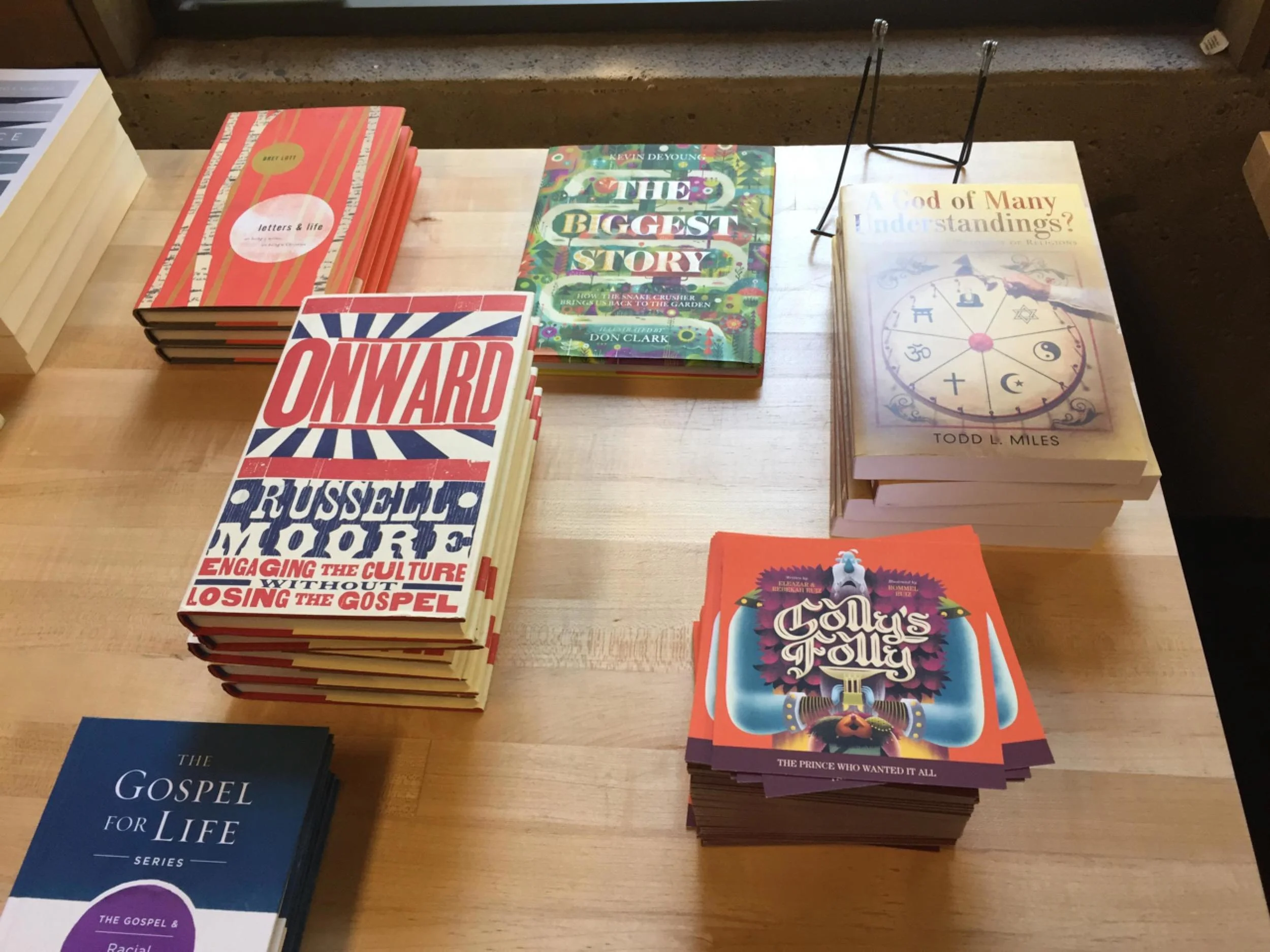 Golly's Folly promo cards on the Humble Beast store tables.