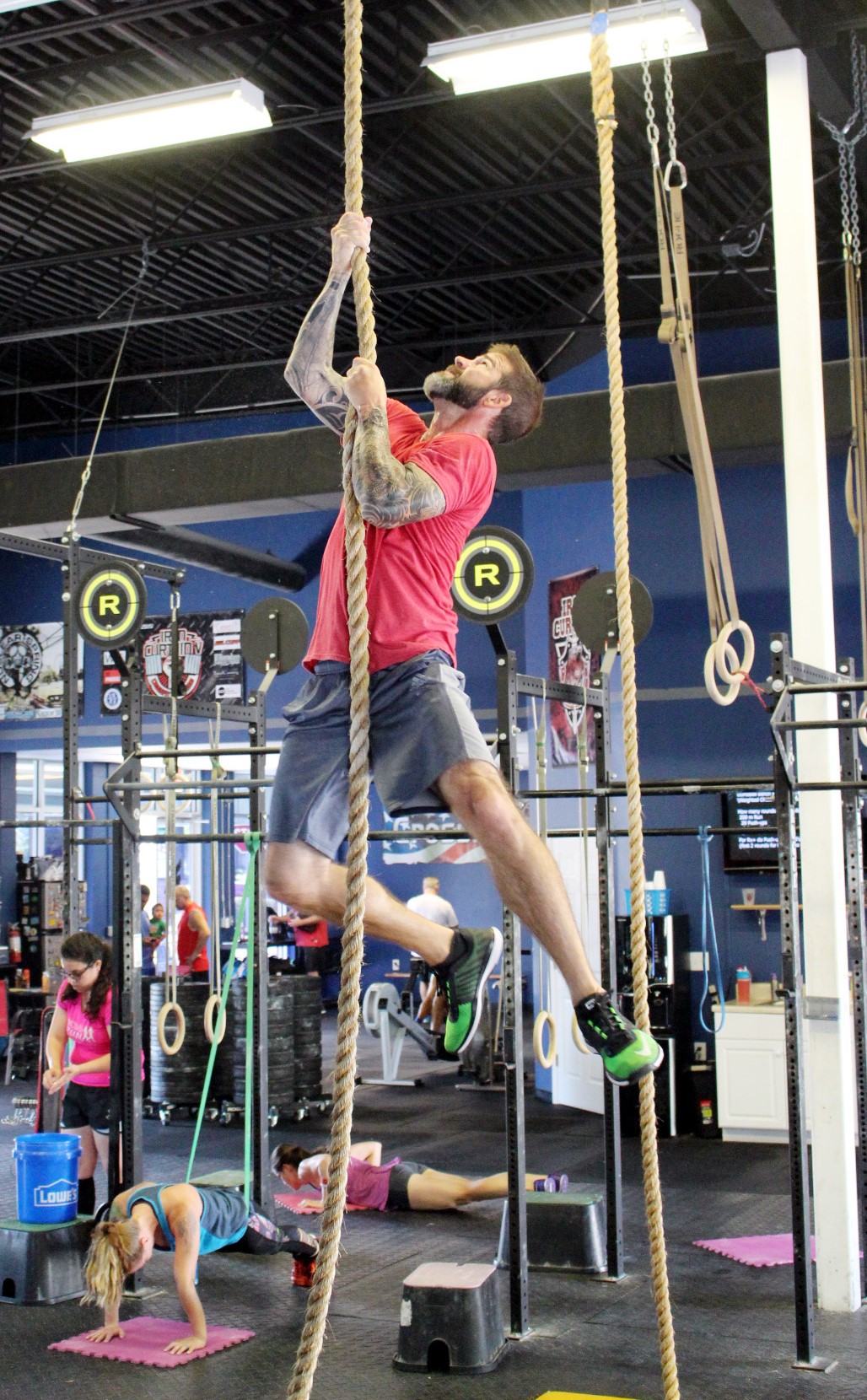 Heath doing a legless rope climb