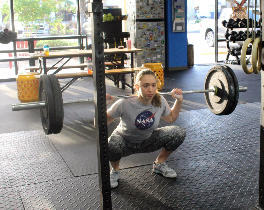 Emily at the bottom of a back squat
