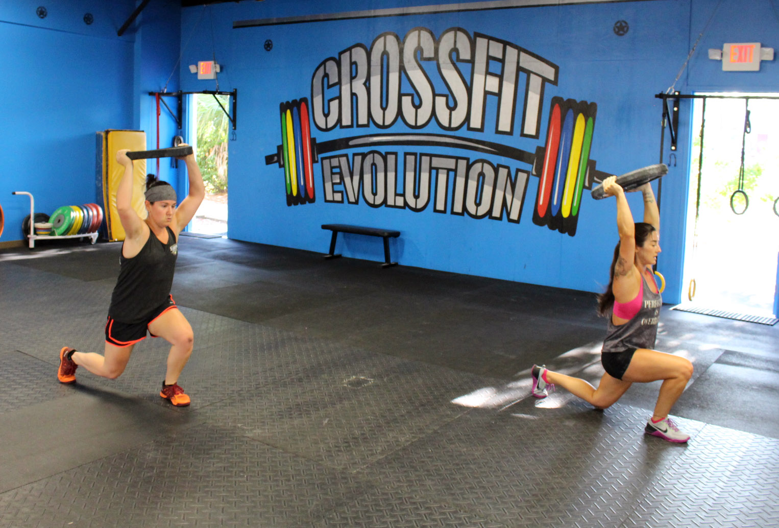 Kayla and Alexa doing Overhead Lunges