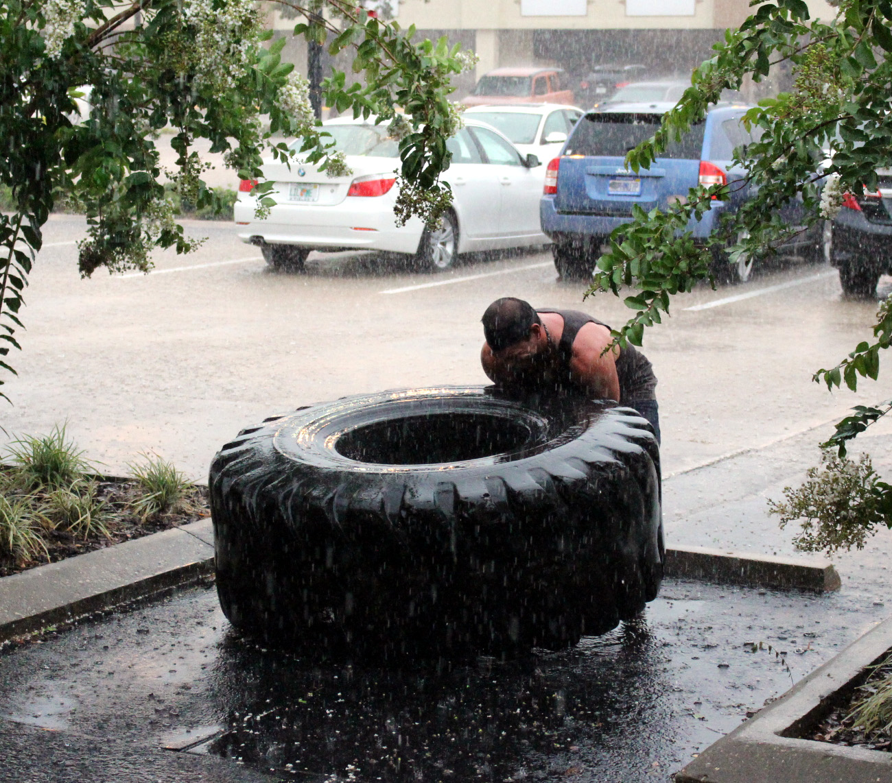 Ismael decided to go and flip tire in the rain to cool off...