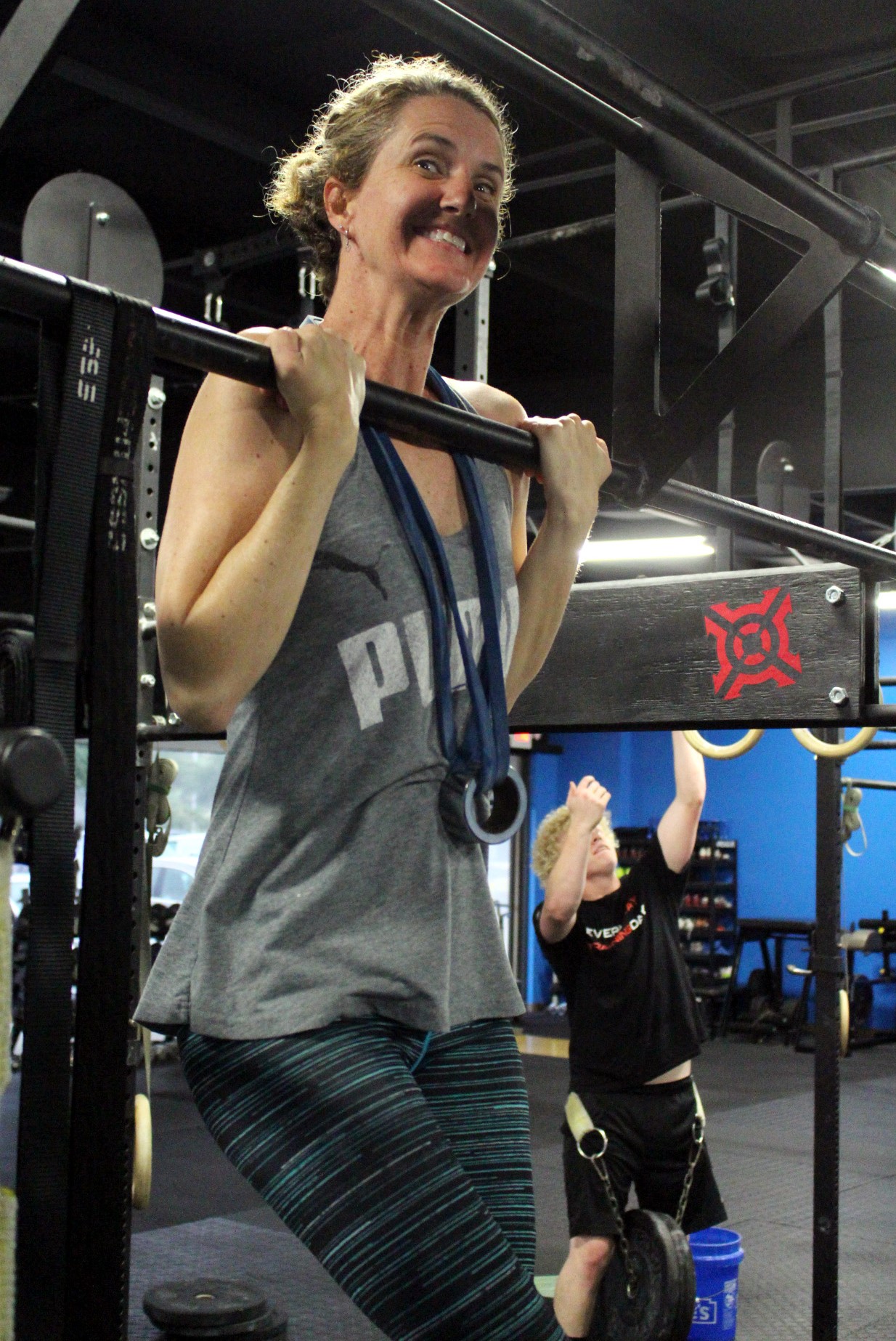 Becky with her first ever Weighted Chest To Bar Pull-up!
