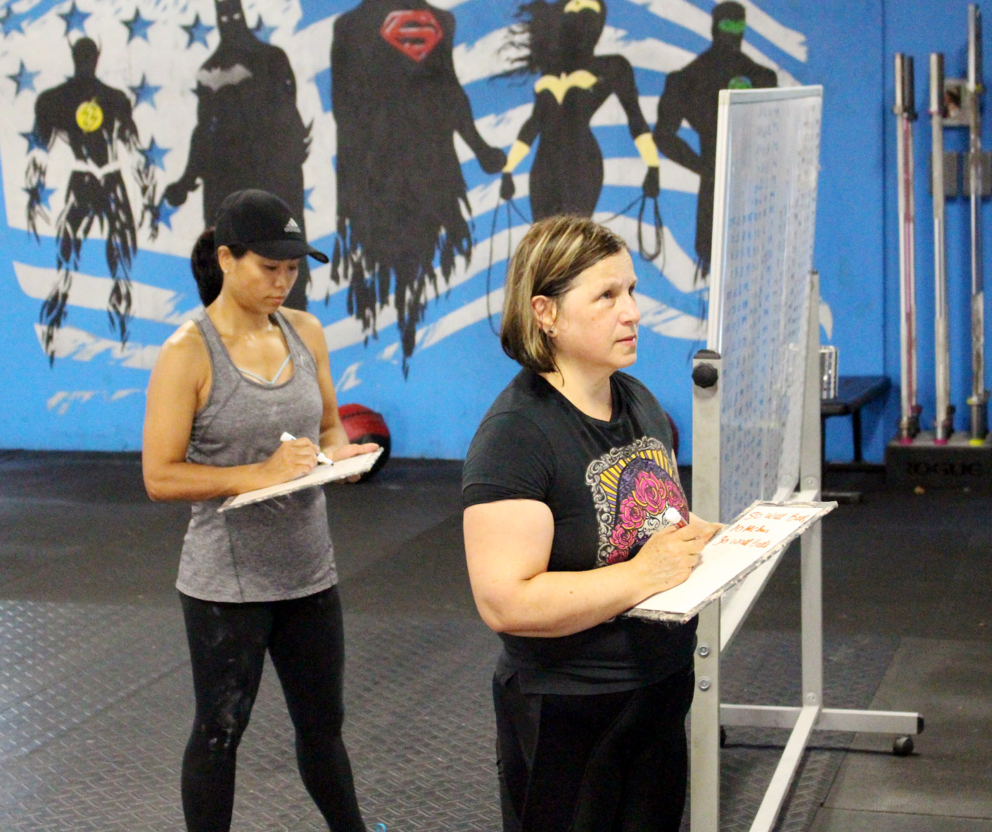 Nandar & Ana doing some maths or probably just writing down the workout.
