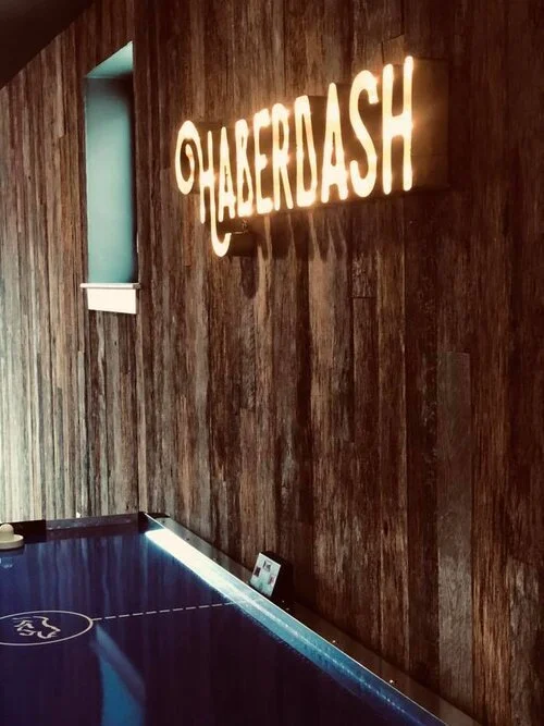 Wood-paneled wall with illuminated