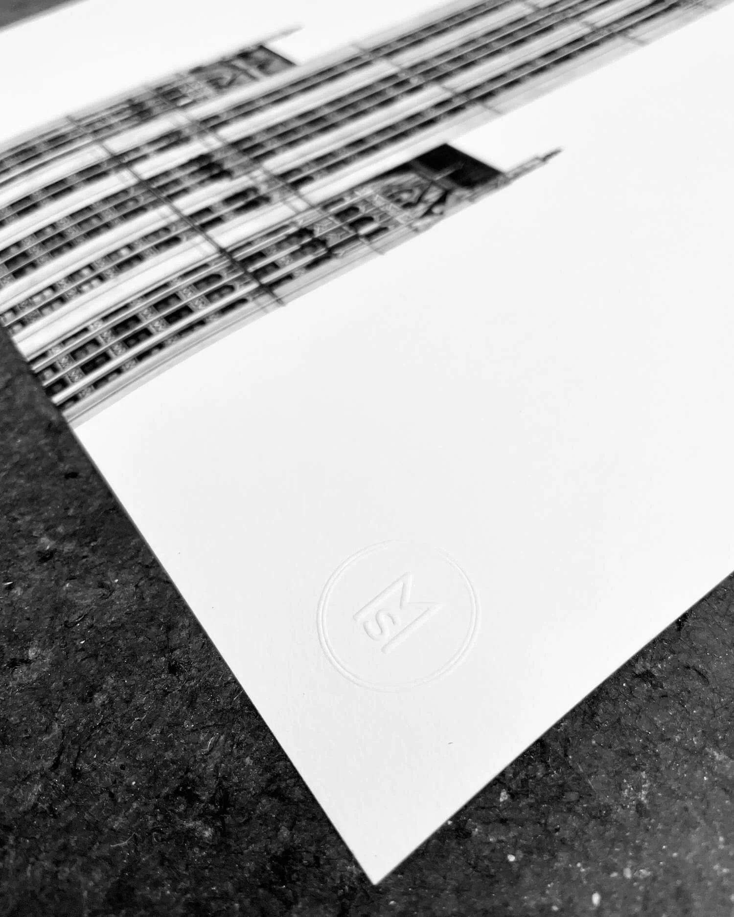 Embossed logo of Minty Sainsbury