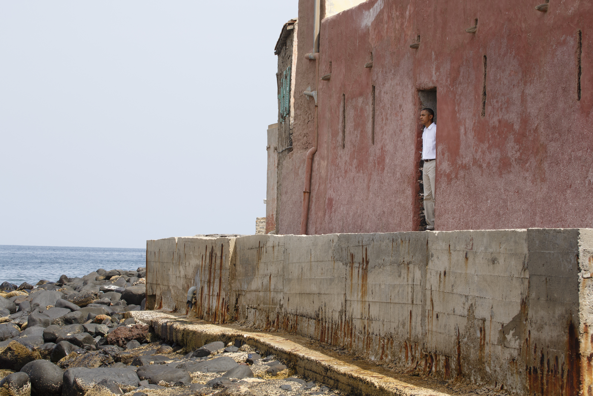 President Obama,  Senegal’s Gorée Island, stands in the “door of no return,” where Africans were led as slaves onto ships bound for America.