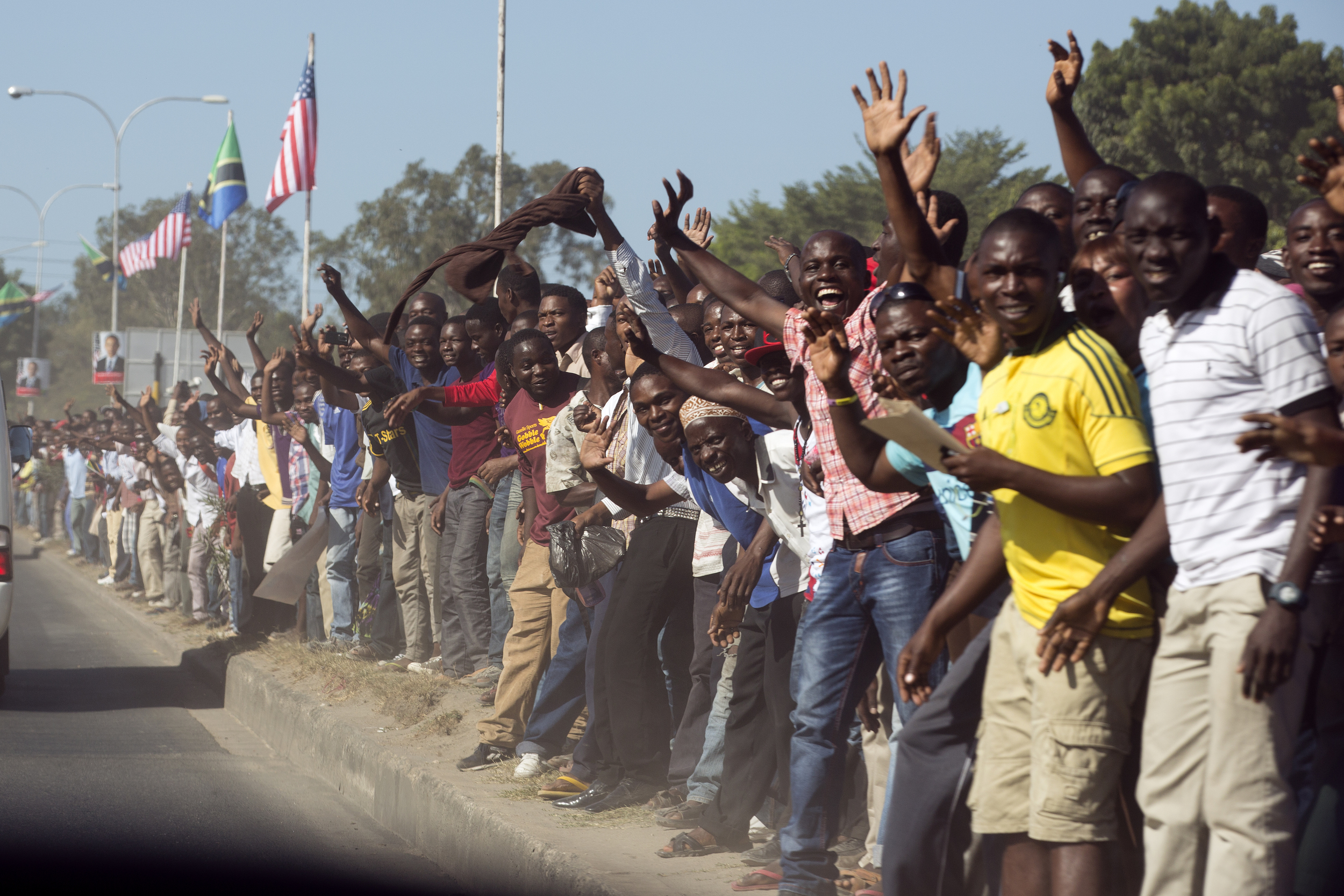 People line the street as President Barack Obama's motorcade travels through Dar es Salaam, Tanzania - 2013.
