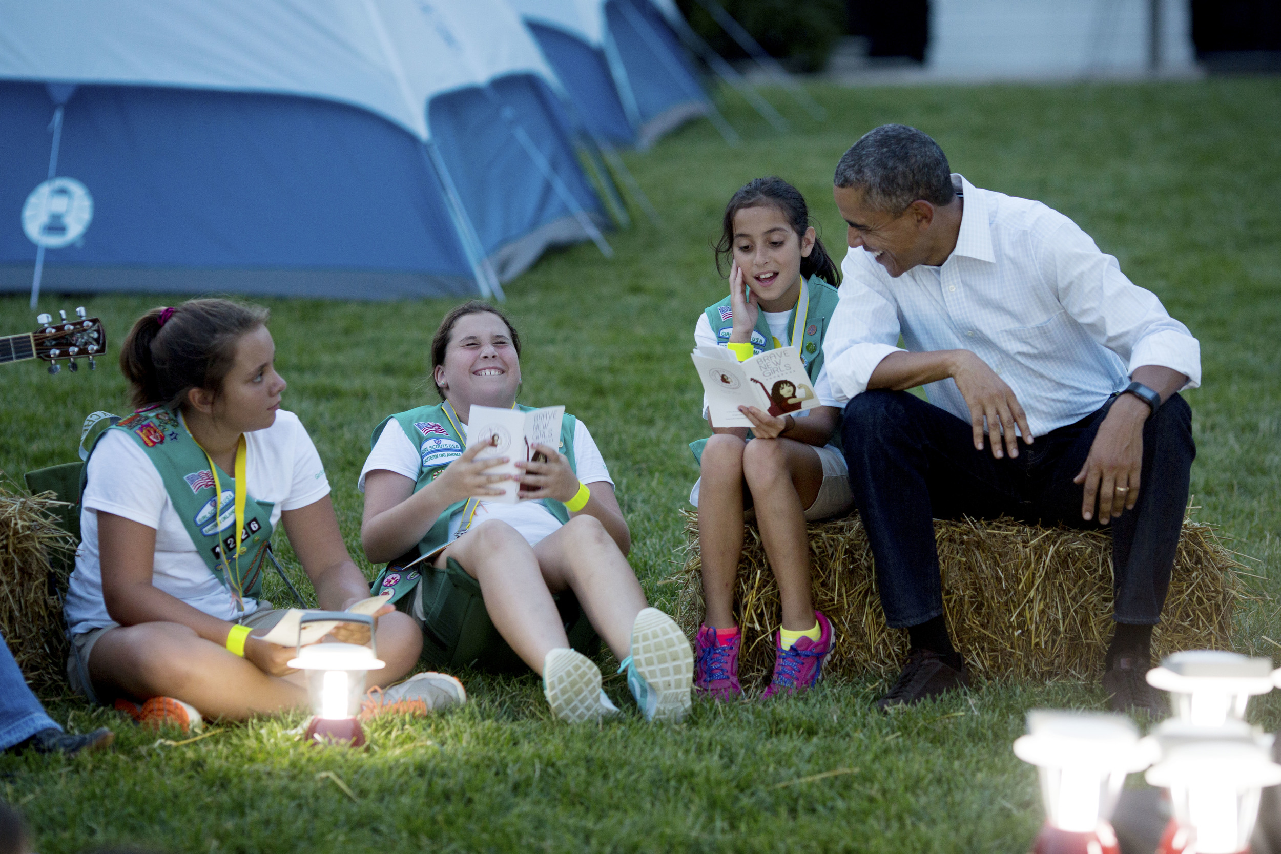 President Barack Obama and First Lady Michelle Obama sing songs with Girl Scouts during the White House Campout, as part of "Let's Move! Outside" on the South Lawn - 2015.