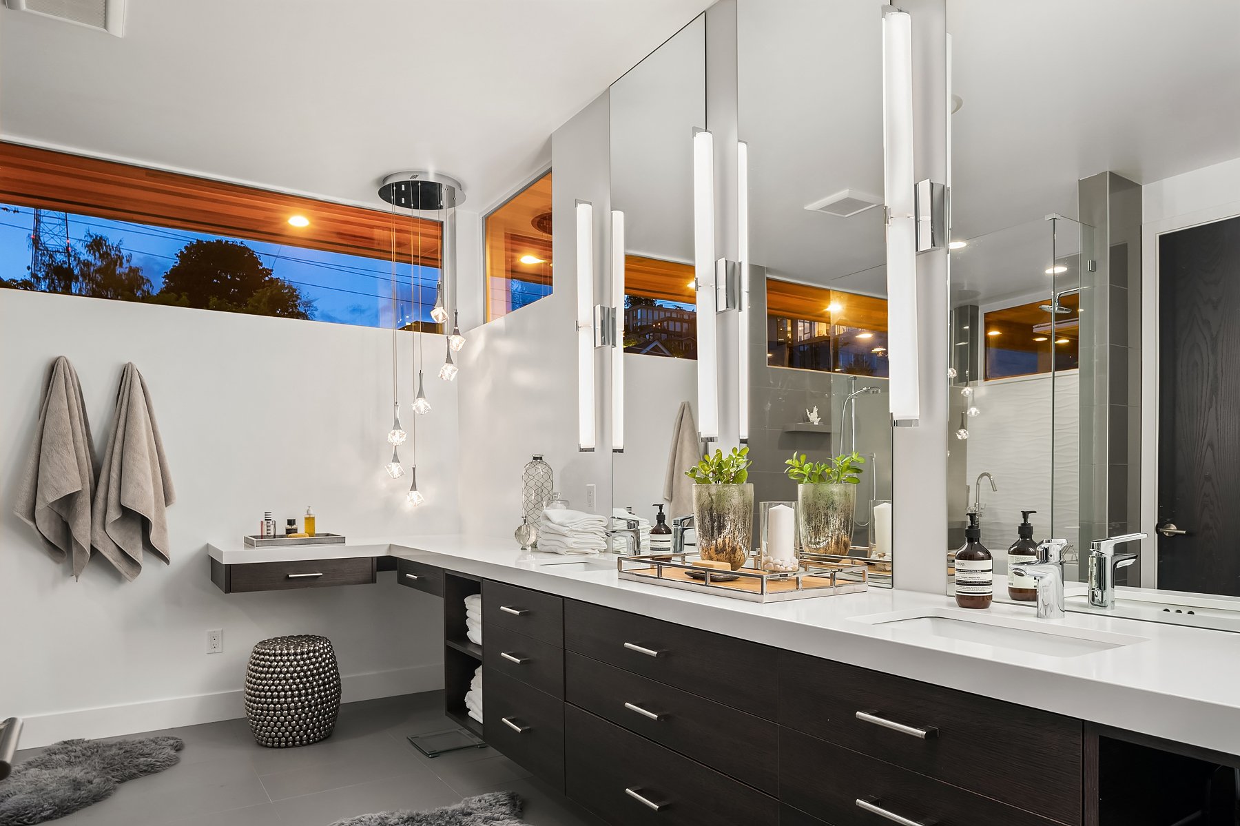  Primary bathroom with abundant storage and mirrors (and lights) and double sinks. 