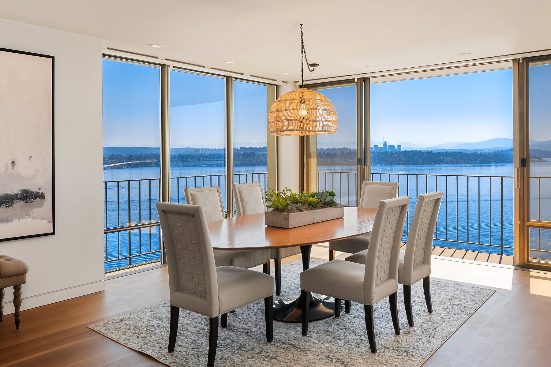  Behind the living room area is the dining room. Imagine hosting your dinner party here with the twinkling lights of the Bellevue skyline all around you. 