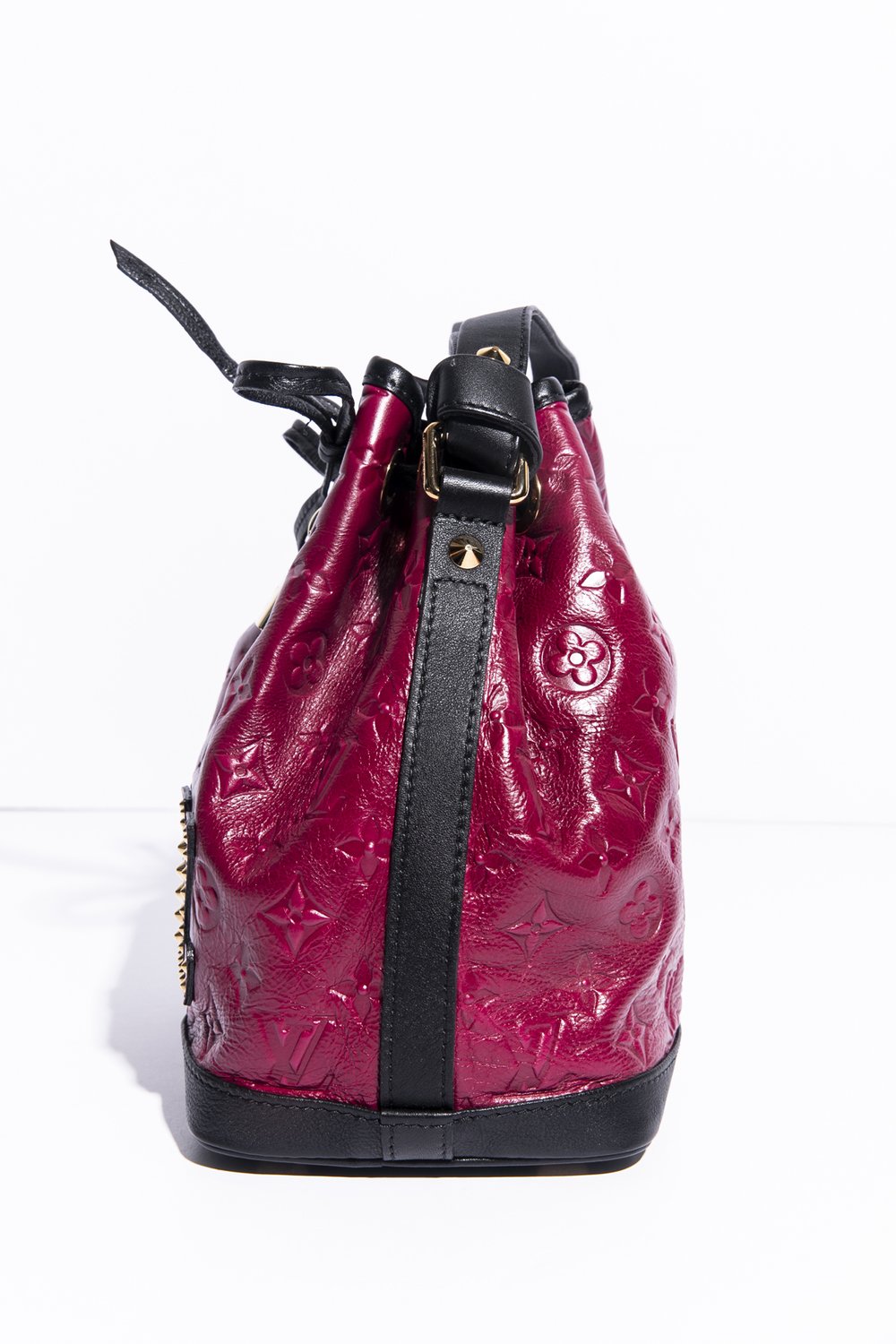 Monogram bucket patent leather handbag