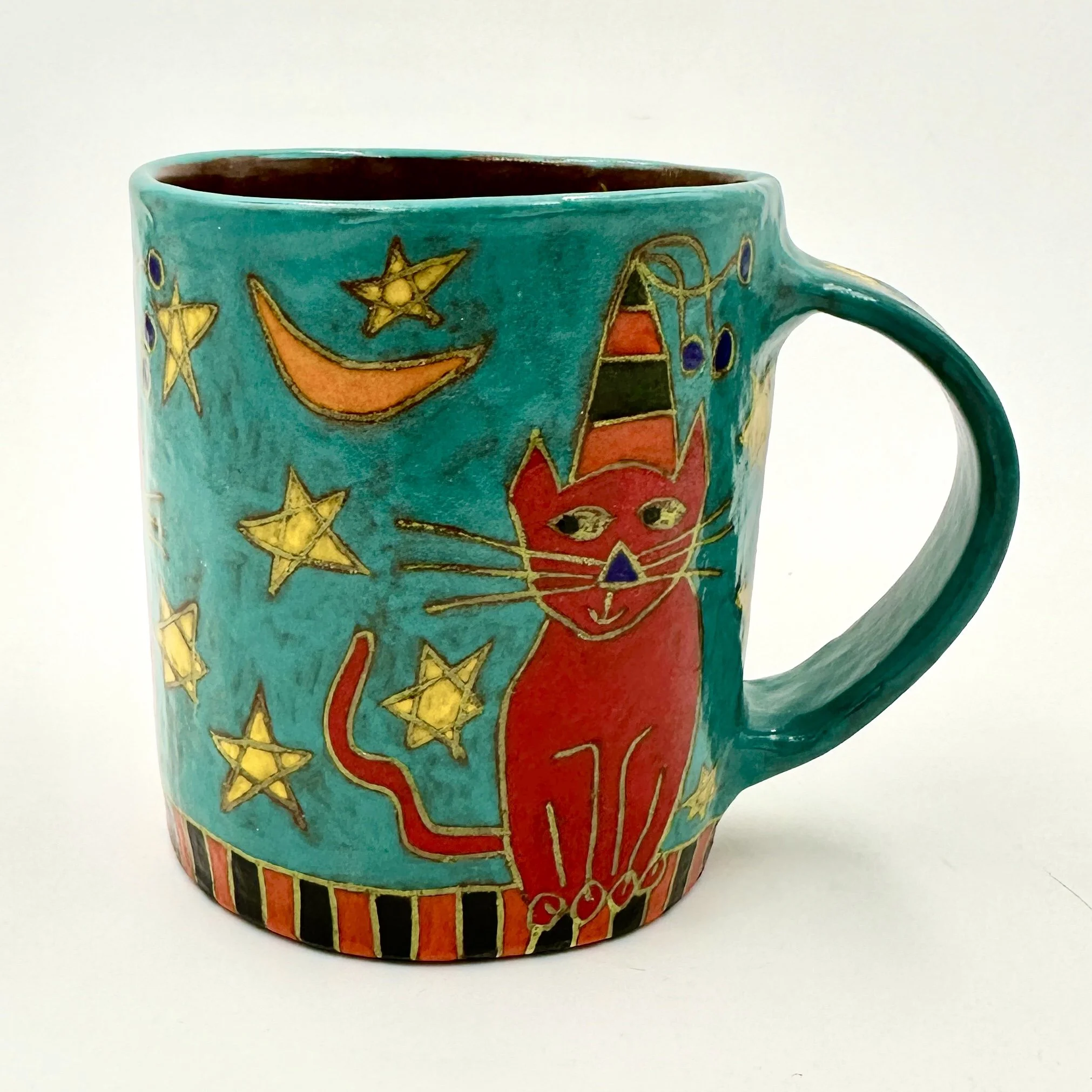 Red Cat sitting with Stars and Moons 1.JPG