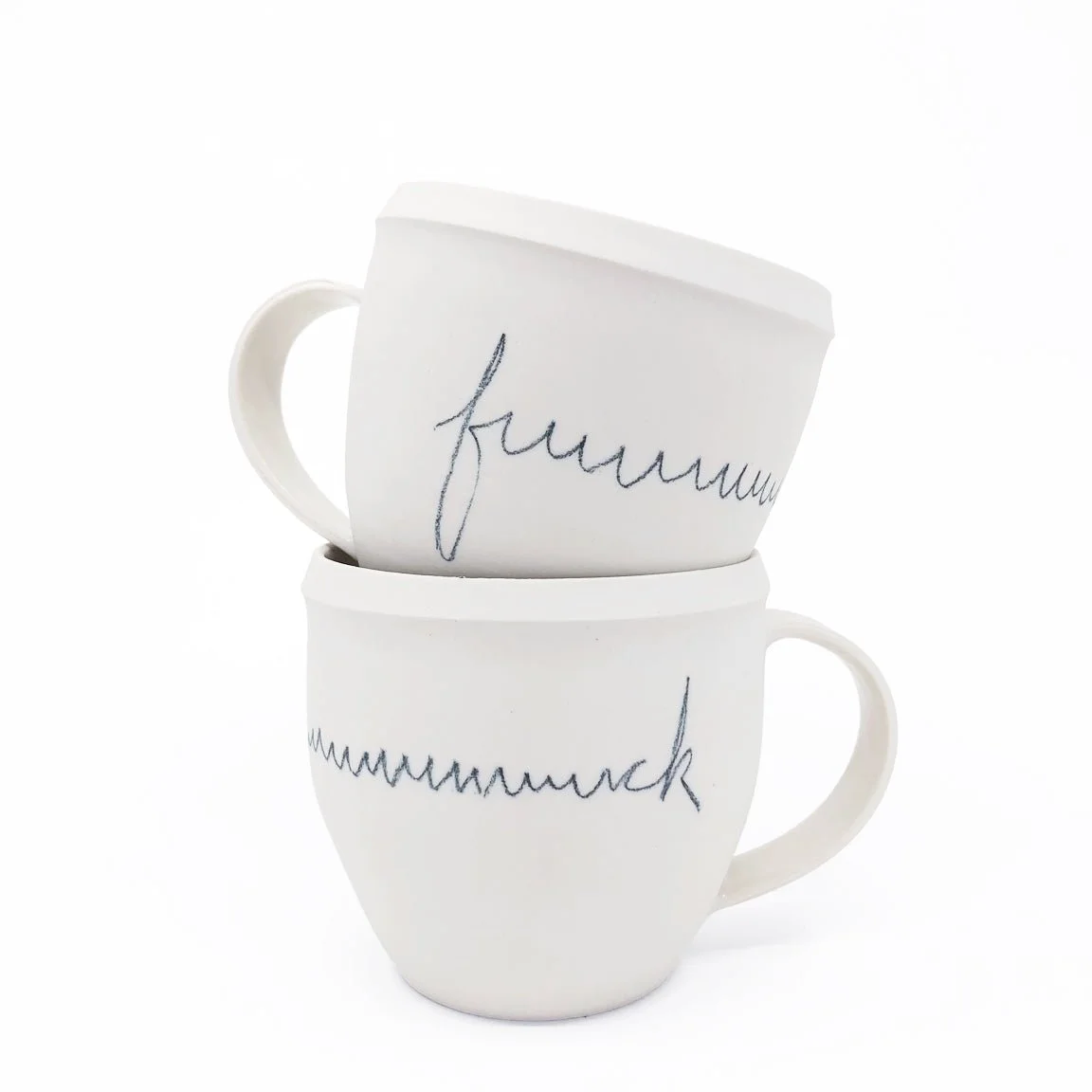 Two white ceramic mugs with "fuuuuuck" written in black.