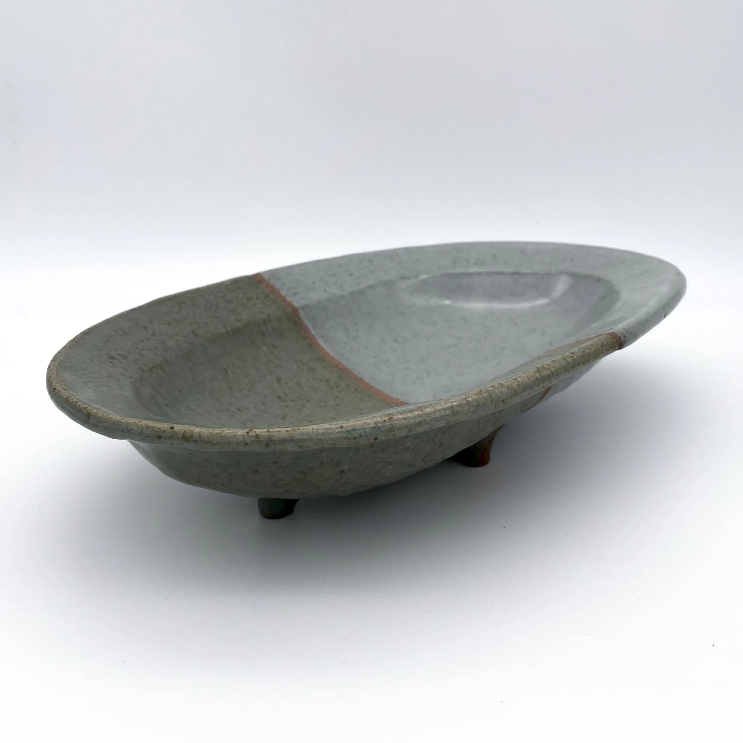 Slate gray and blue gray ceramic dish with feet.