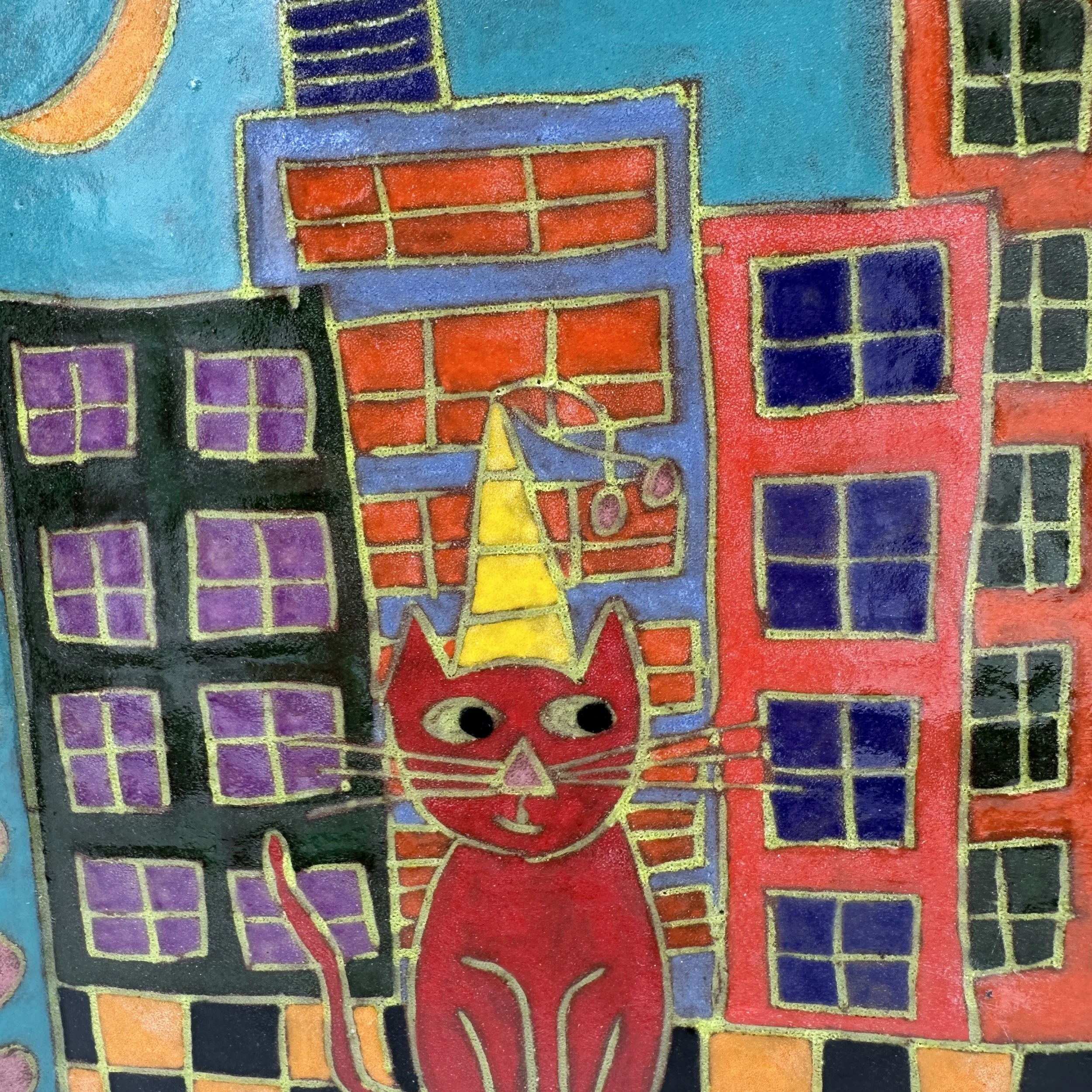 Red Cat sitting in City Close Up.JPG