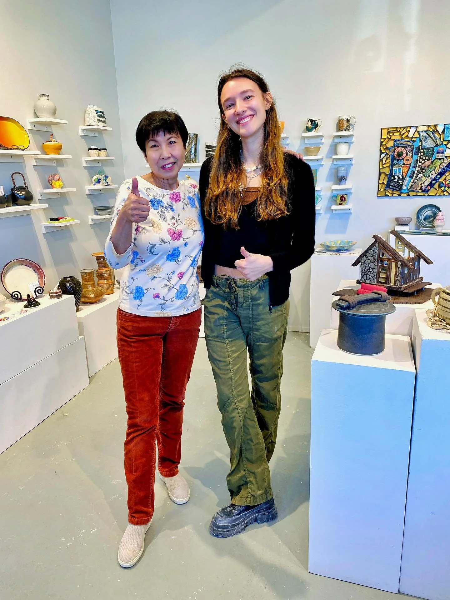 Clay Art Center&rsquo;s annual Hand in Hand Auction is ready to preview! Thank you to Board President Sally Ng and Second-Year Artist-in-Residence Carley Holzem for helping us with the final part of installing the display of  incredible works donated