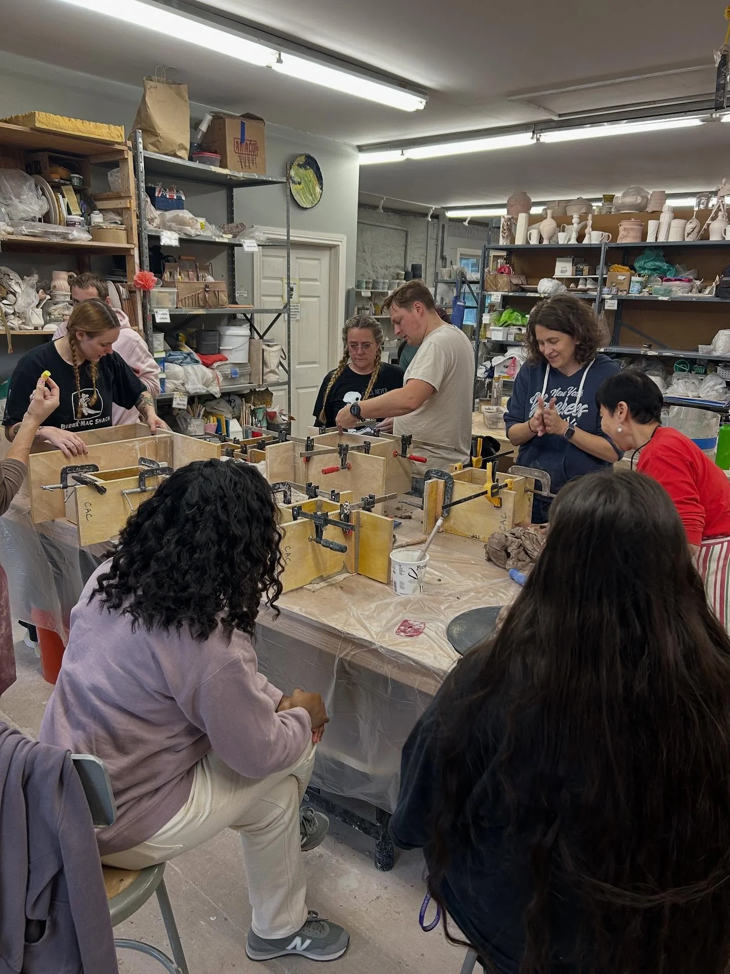 Clay Art Center staff took some time out of their day today to work on their own clay projects. Experienced mold makers on staff, helped teach their less experienced colleagues the process of making simple one and two-part molds out of plaster. Mold 