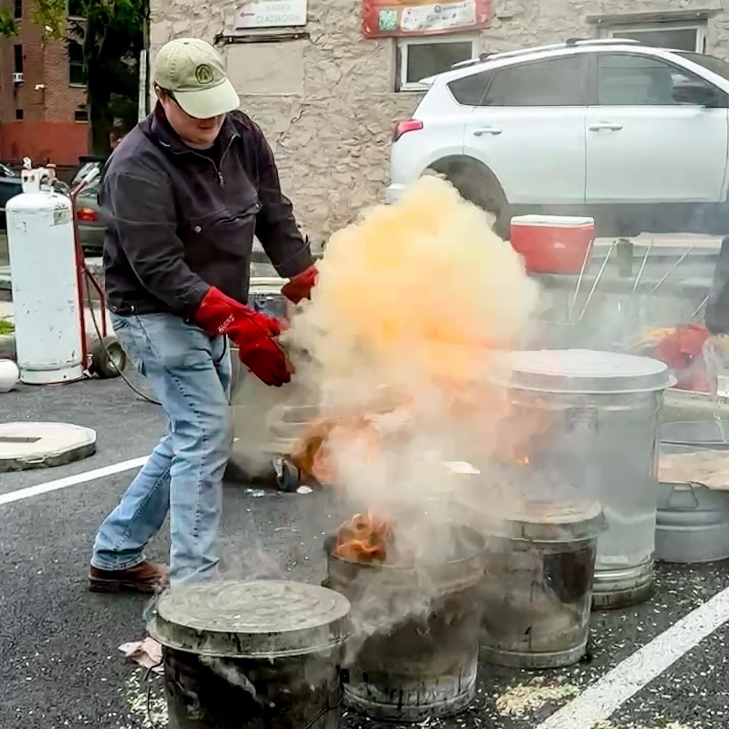 August works a raku firing