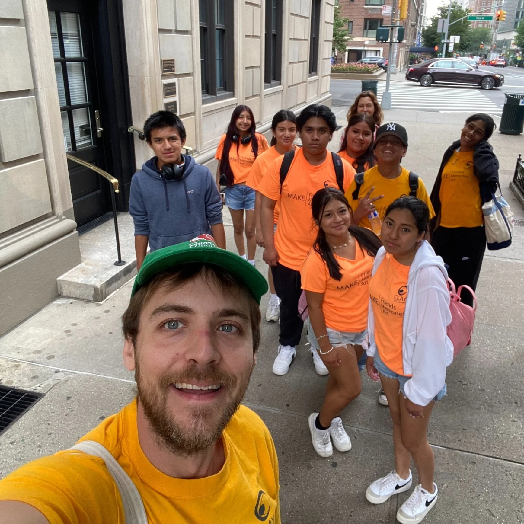 A selfie of the group of students and their teachers on the street in New York City