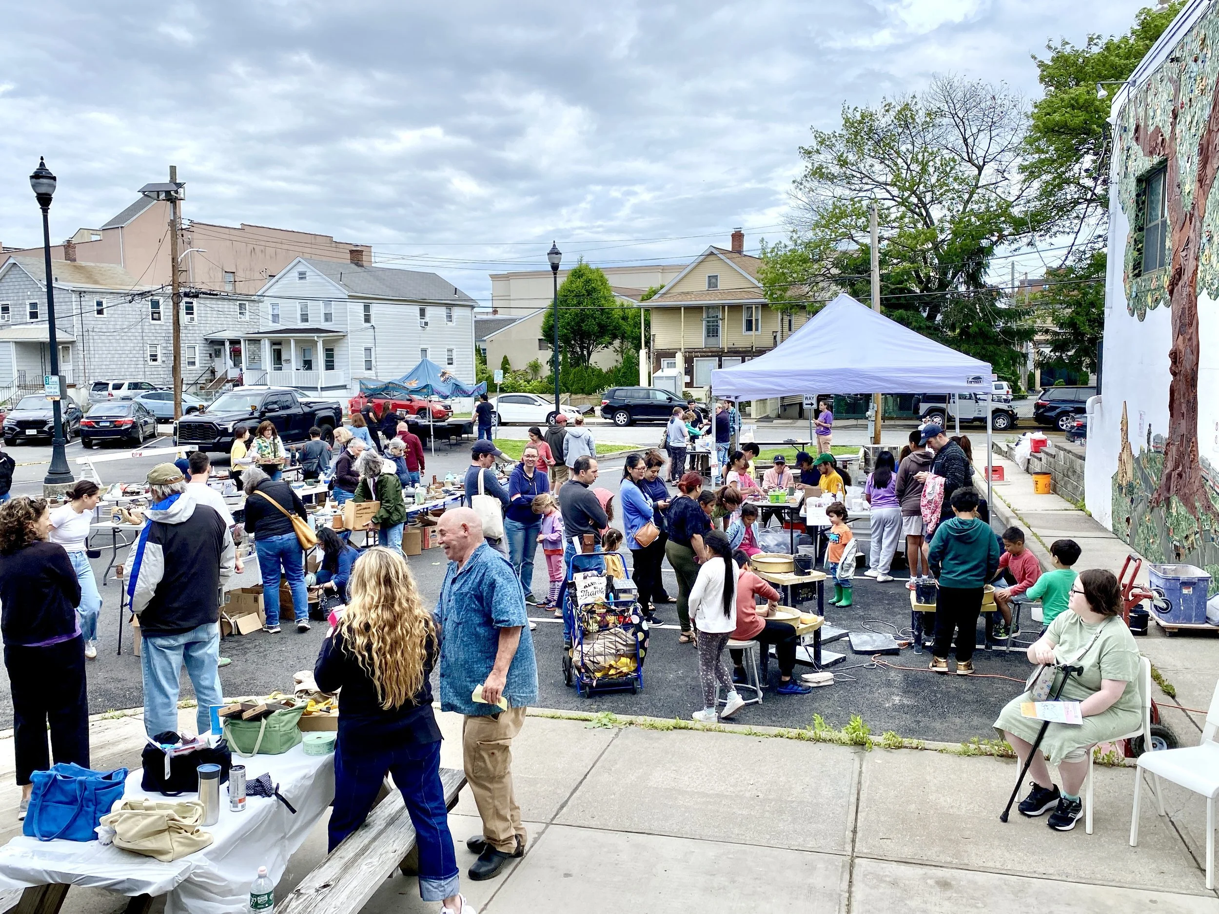 Wide angle view of the crowd at the outdoor pottery sale