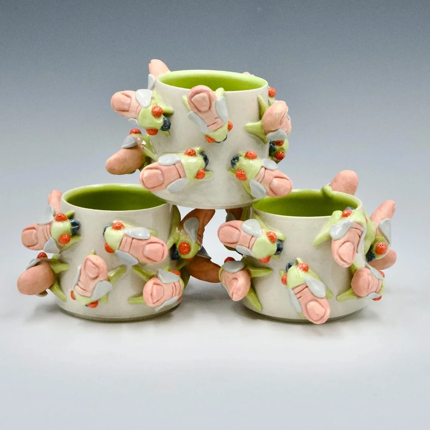 Clay Art Center Shop Featured Artists for Pride Month are Gabs Conway and Anika Major. Drinking vessels from both artists are available now in our online shop, or visit the shop in person at our Port Chester location.

Images:
Gabs Conway | Swarm Cup
