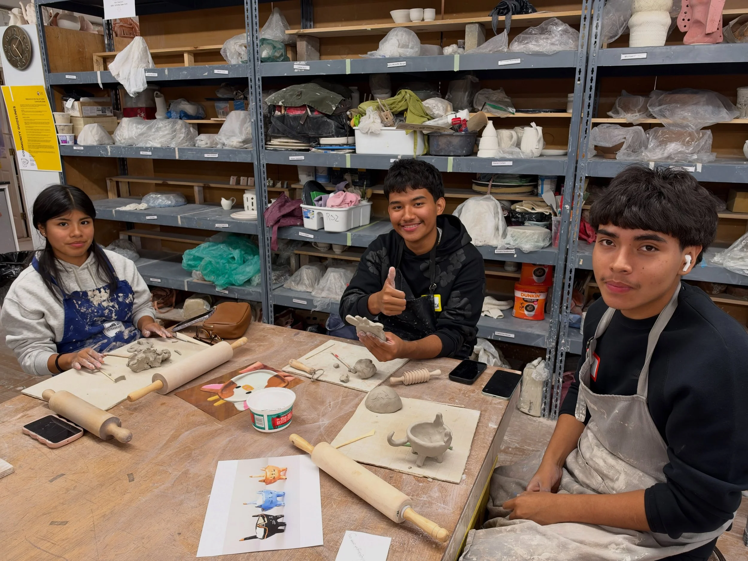 Community Arts at Clay Art Center 

This week in Around the World in Clay, students in the high school group were asked to draw inspiration from their own culture. Inspirations ranged from mu&ntilde;ecas Lim&eacute; (faceless Dominican dolls) to Ecua