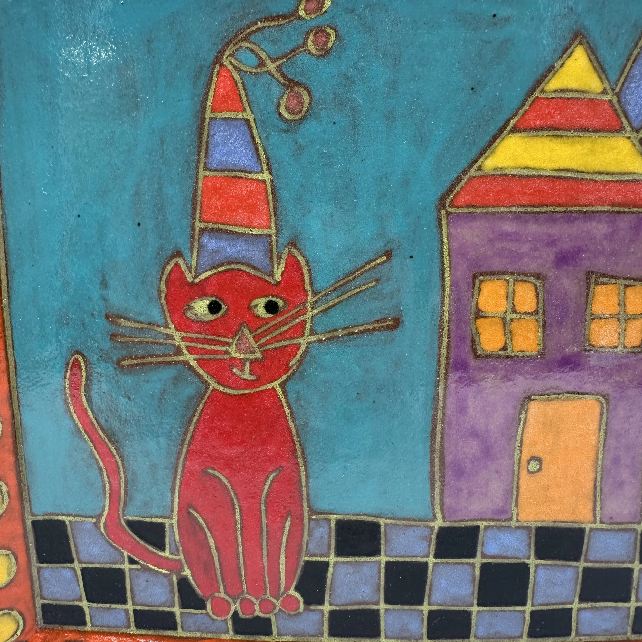 Plate Cat Sitting Next to House Close up.JPG