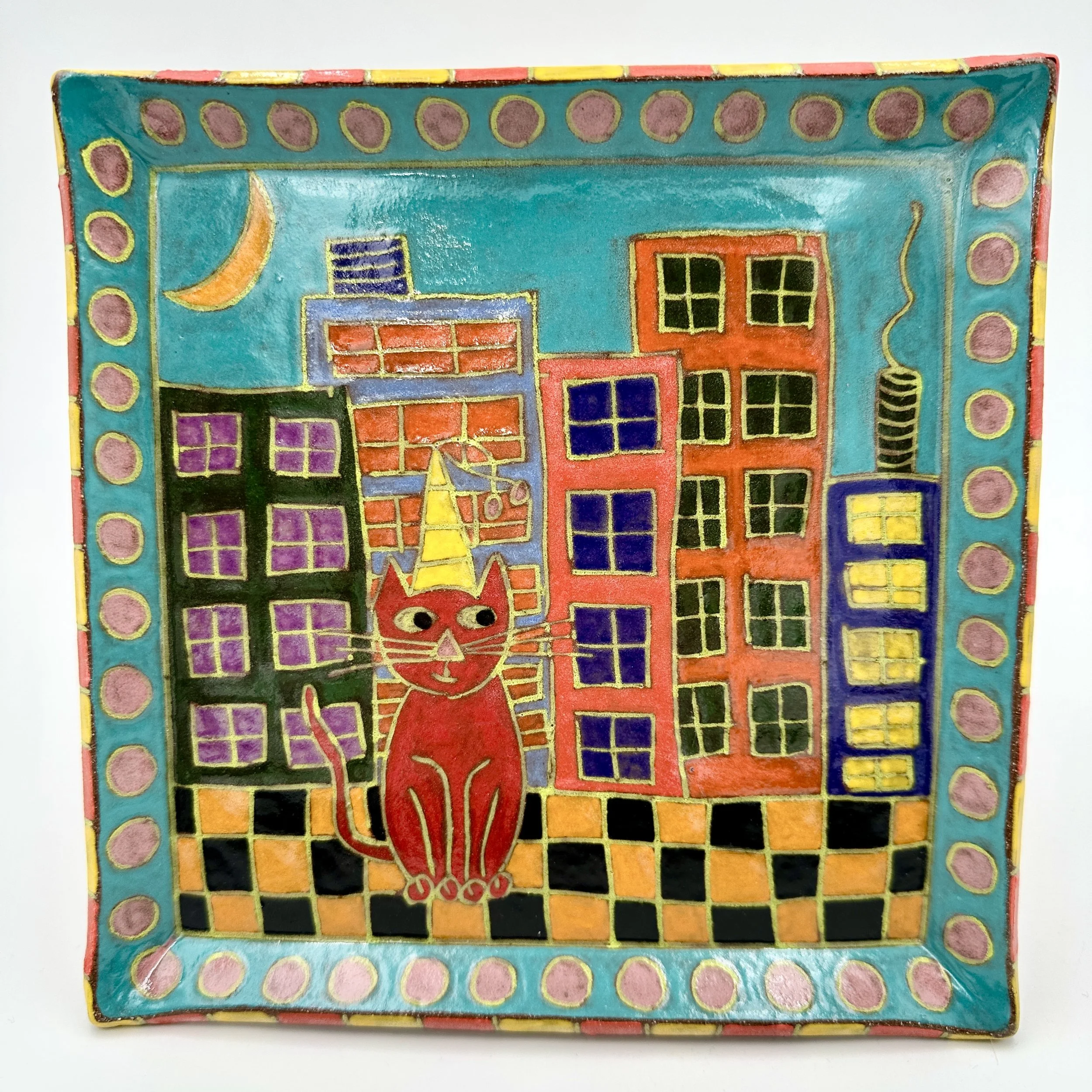 Red Cat sitting in City.JPG