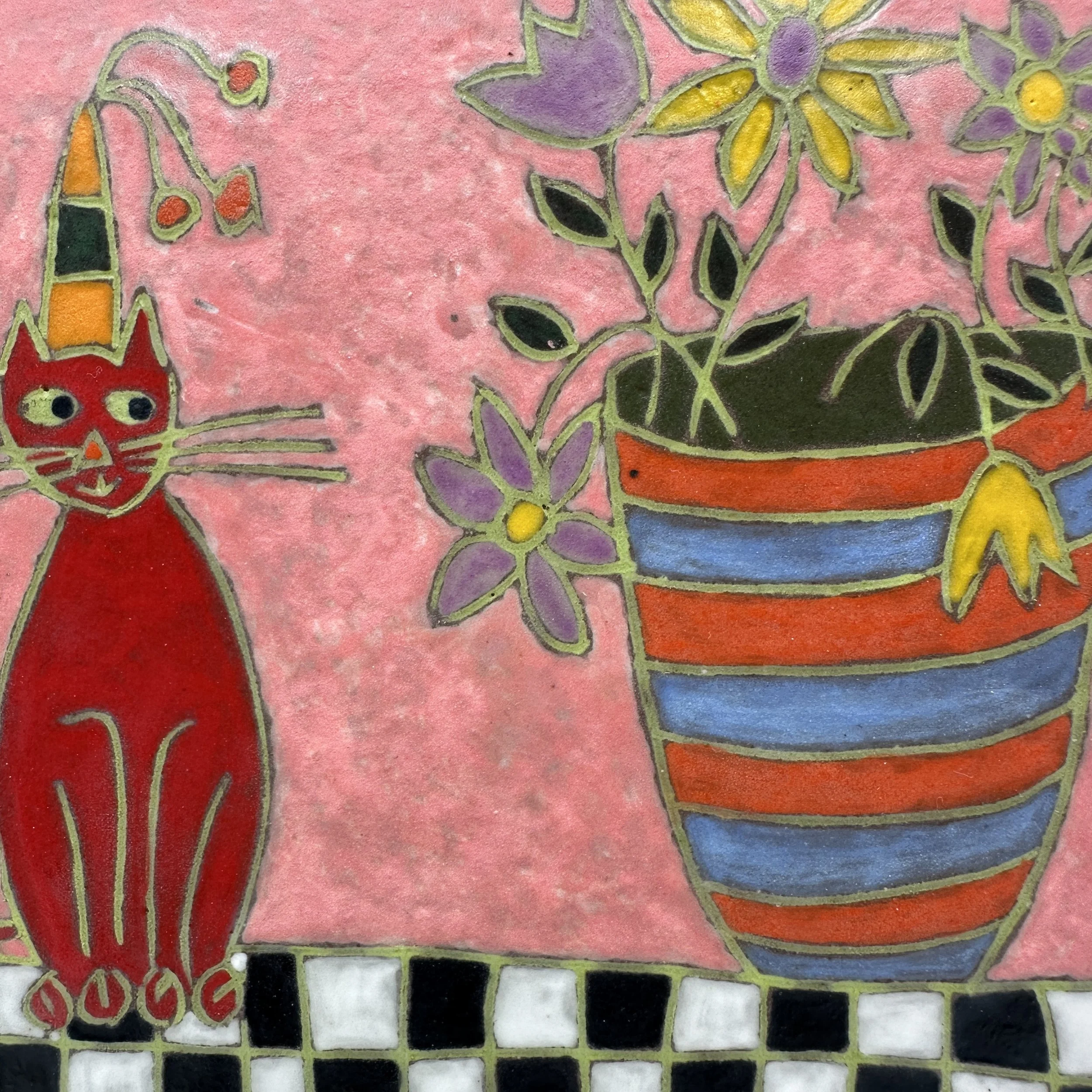 Red Cat with Purple and Yellow Flowers Close Up.JPG