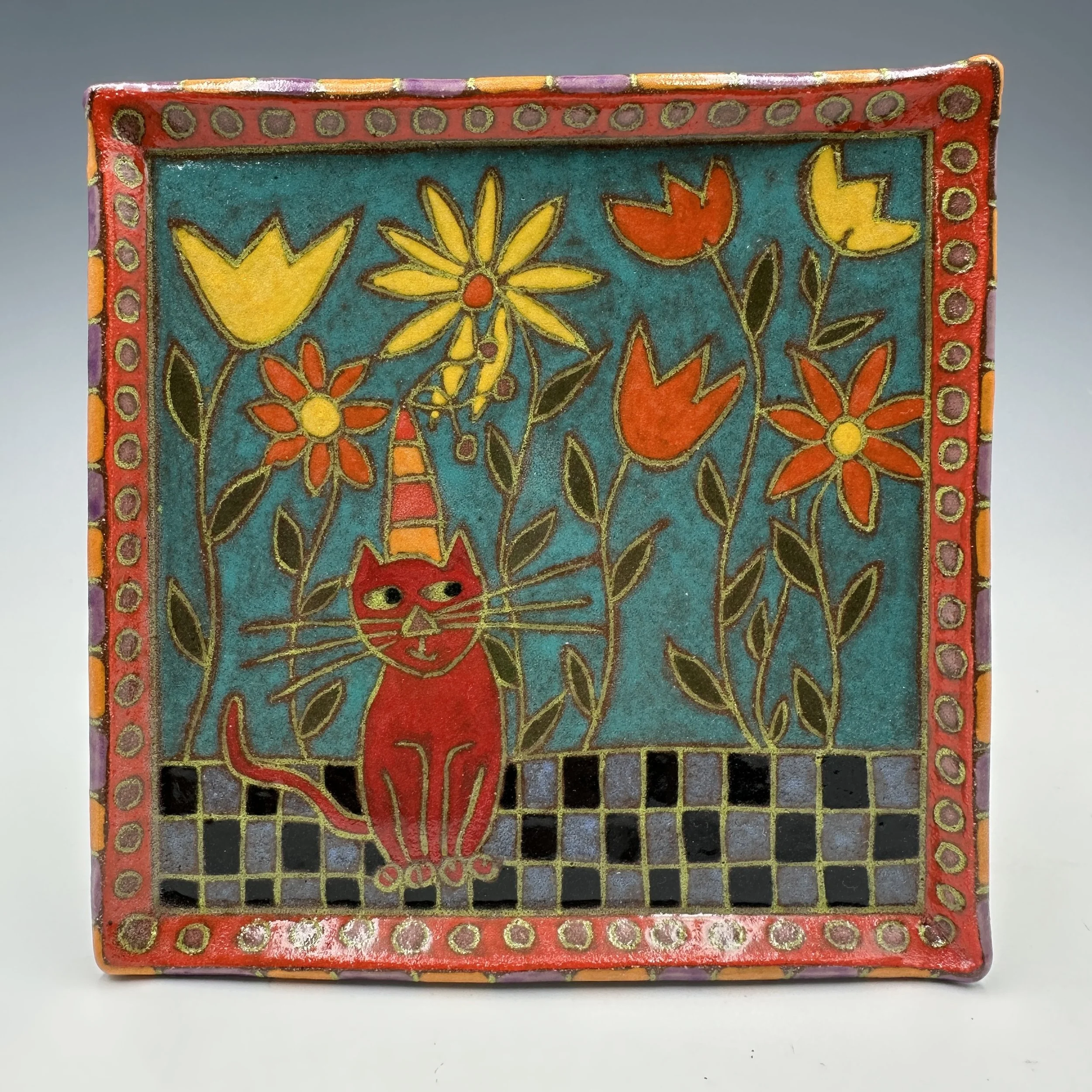 Plate Cat Sitting in Flowers.JPG