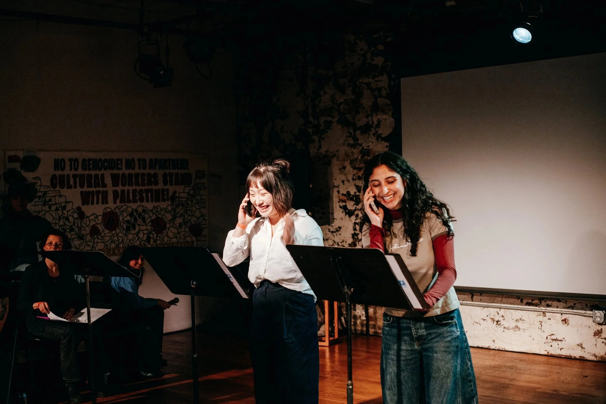  From the 2026 Solidarity Fest reading of  Enemies of America , directed by Jess McLeod. Pictured: Heesun Hwang, Nadia Dandashi. Photo: Geve Penn. 
