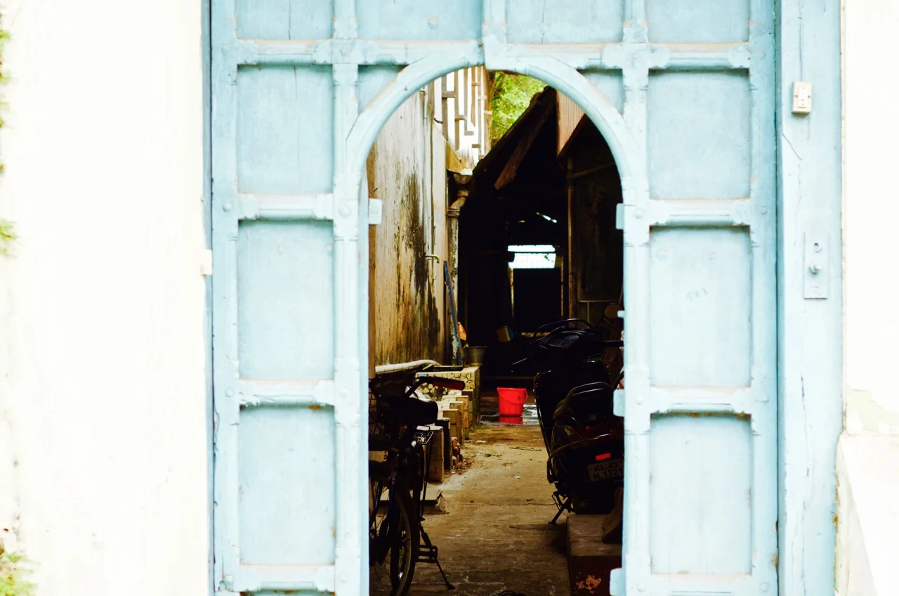 Gateway into an old warehouse, that is now a rented lodge for spice market workers