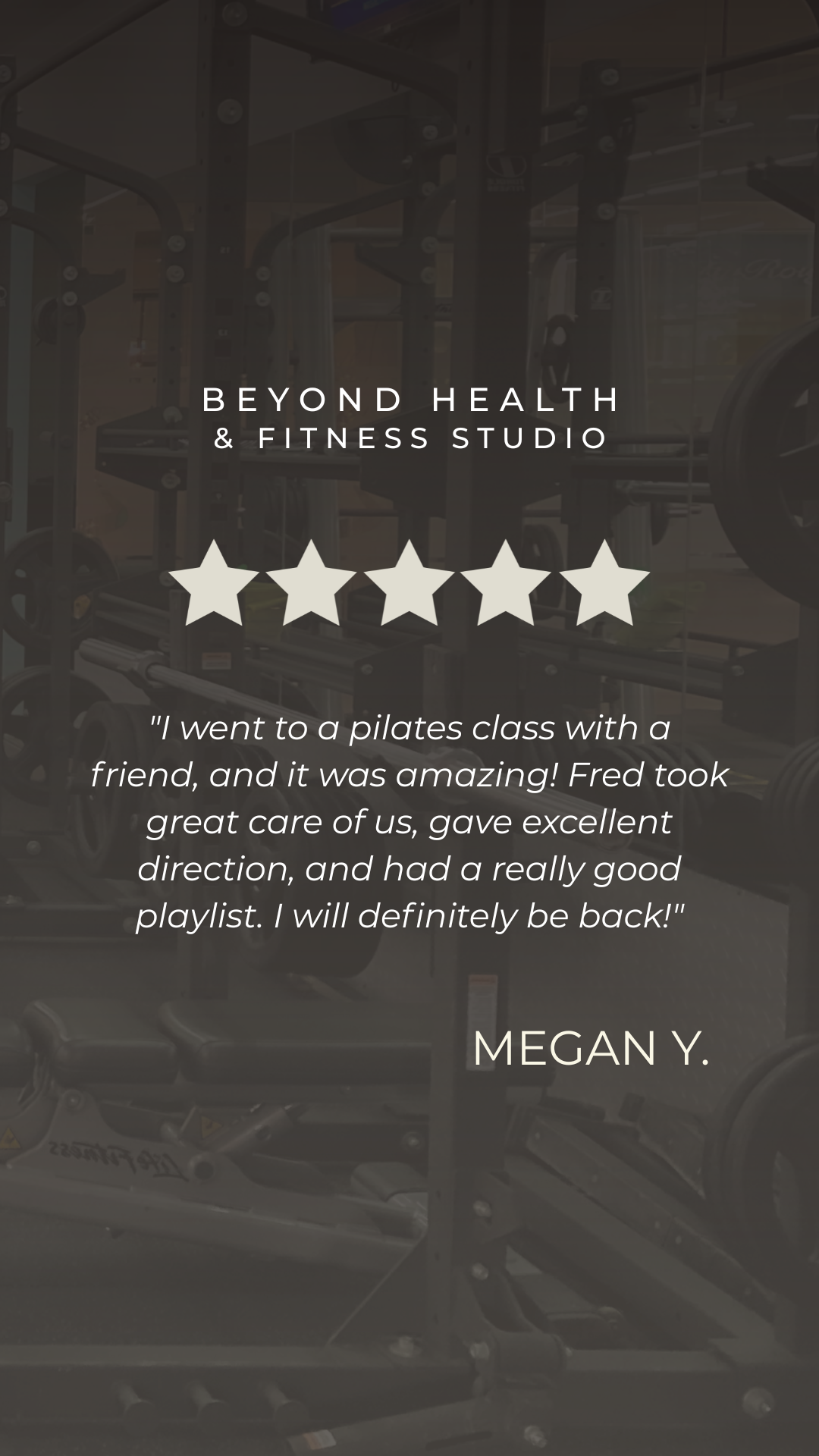Glass window of Beyond Health & Fitness Studio with workout equipment inside, including weightlifting racks and exercise machines.