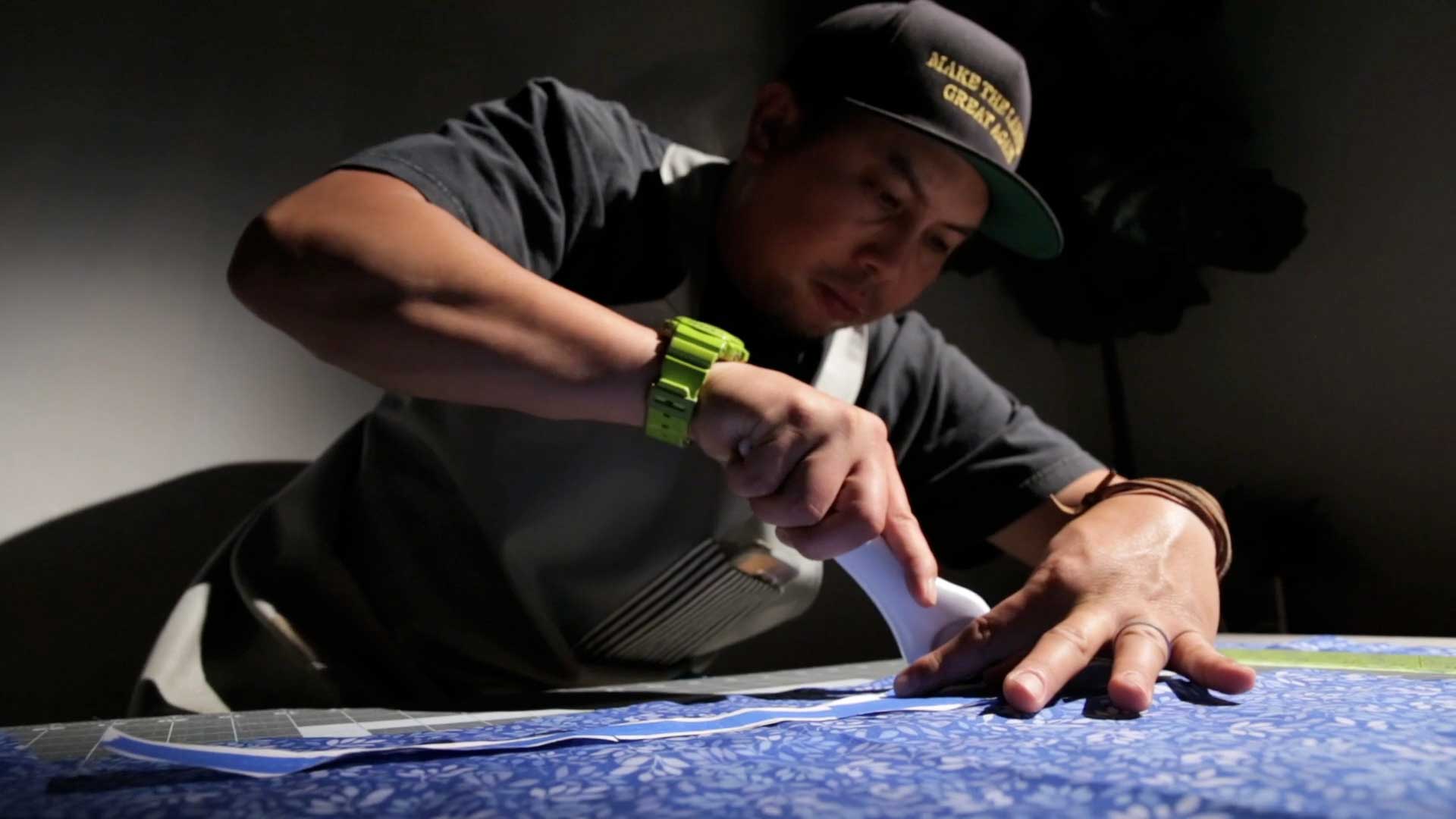 Andy Alvarado busy crafting some ties
