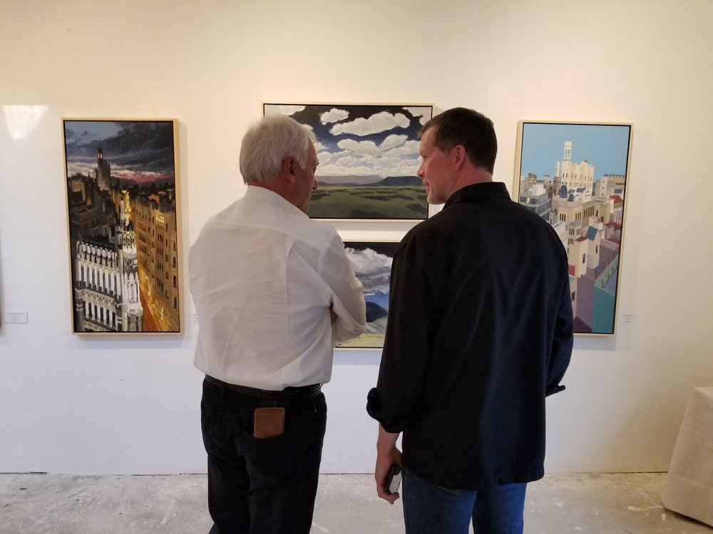 Discussing which cityscape or landscape was John's favorite.