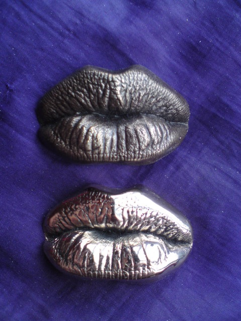 real bronze kiss casts (patinated and polished).jpeg