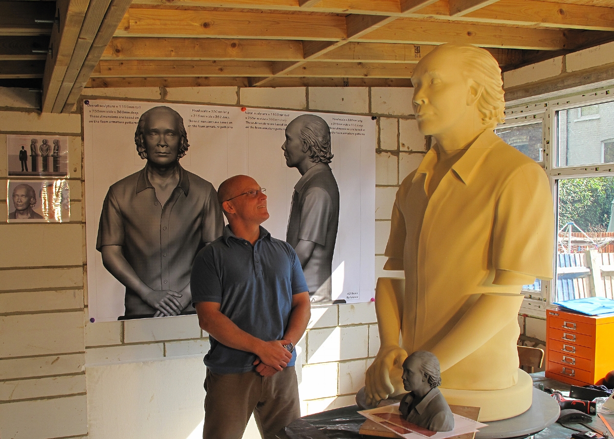 André Masters with large memorial sculpture