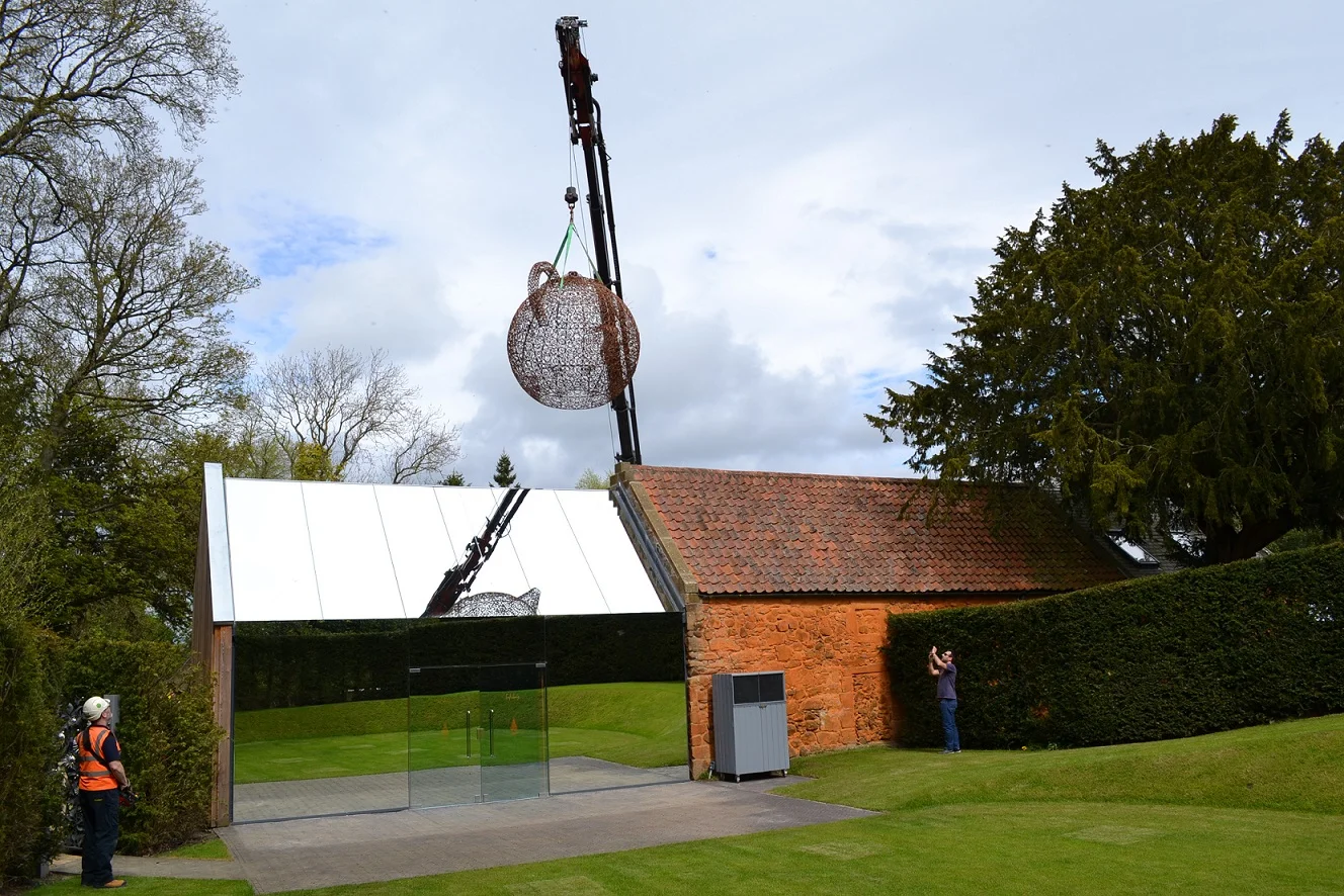 the teapot makes it way over the building