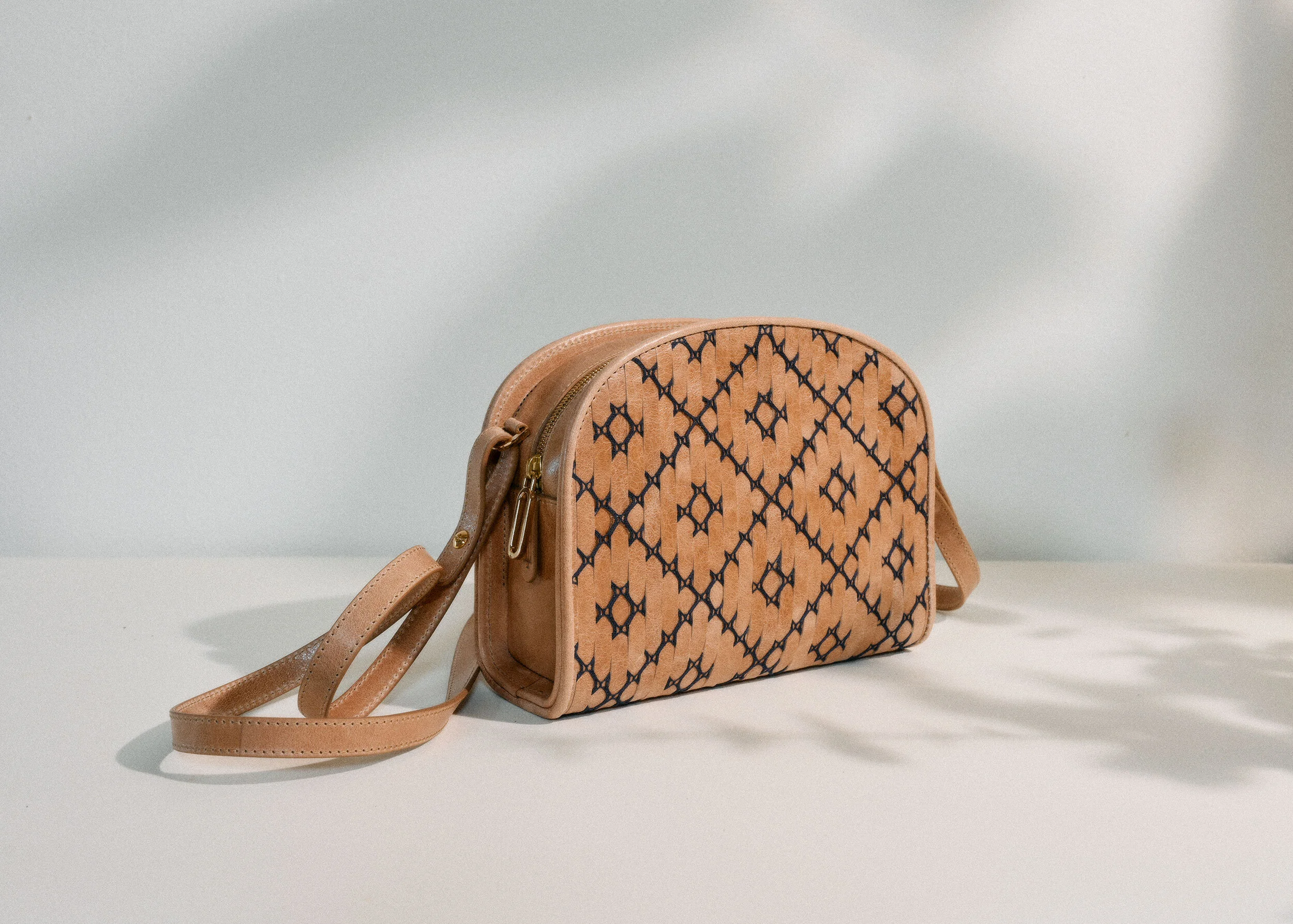 The Half Moon bag in Tablet. Handwoven in Scotland using Italian vegetable-tanned leather from Tuscany.