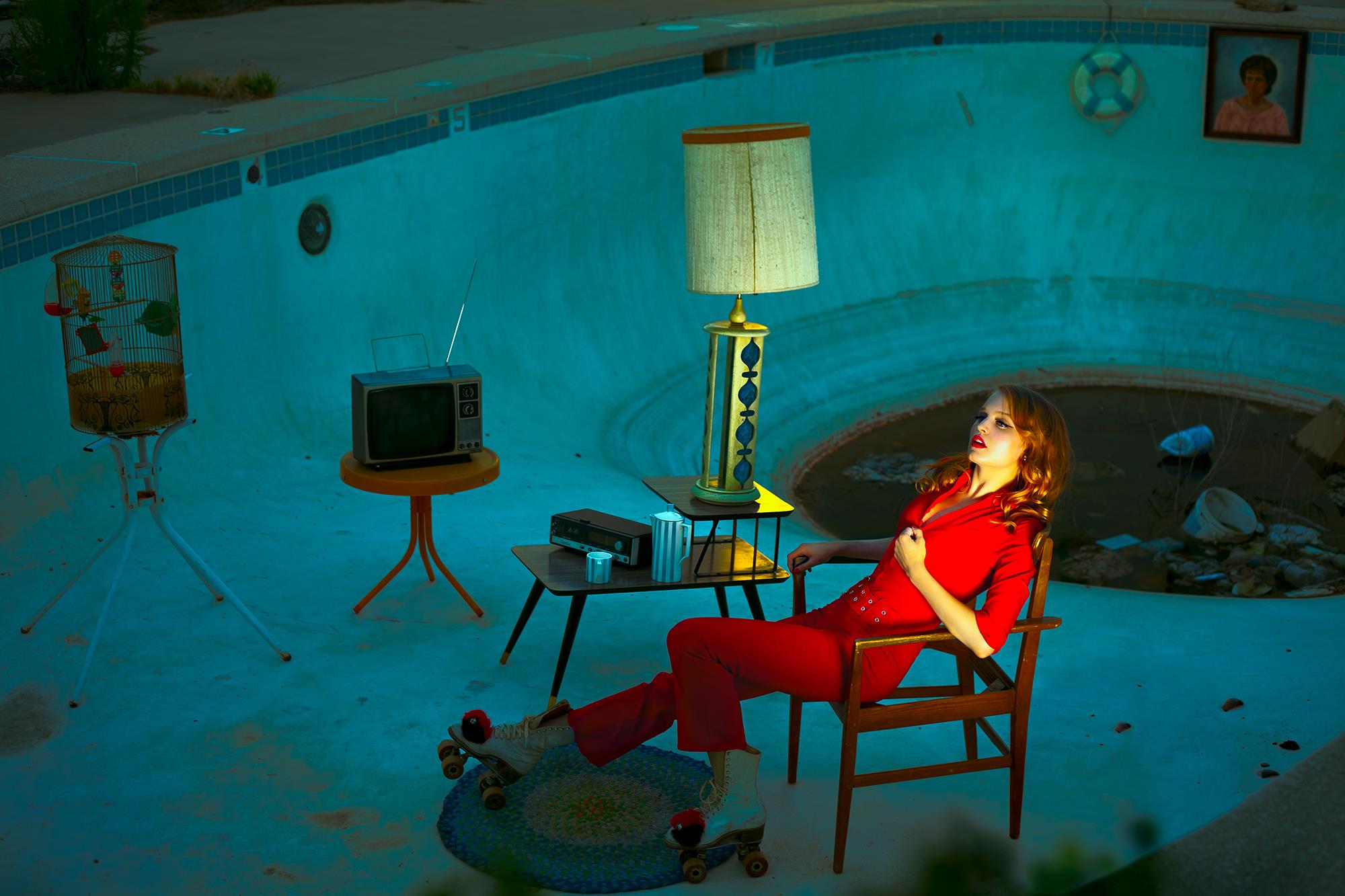 This is my personal fave. It was challenging in a lot of ways. We got permission from the owners of the now demolished Desert Sands Motel on Route 66. When we got there to shoot, they said it had been a Breaking Bad location and they'd have to charge us 1500 to shoot a few pictures. We said that that had not been what they initially said, then they said the deal was off. They'd only let us shoot if we were guests (the place was inhabited by drug addicts). I said fine, rent me a room. The owner said no. Then a lady walked in and asked for a room "only for half an hour". They rented it to her for $5... I protested, and then we got kicked out. So we ended up looking for a new location just an hour before dusk, and ended up in an abandoned trailer park with this beautiful pool... We put the skates on the model, who almost rolled down to the nasty puddle of water you can see in the picture. Oh, the glamorous BTS of creative teams... - Rebecca Massey 