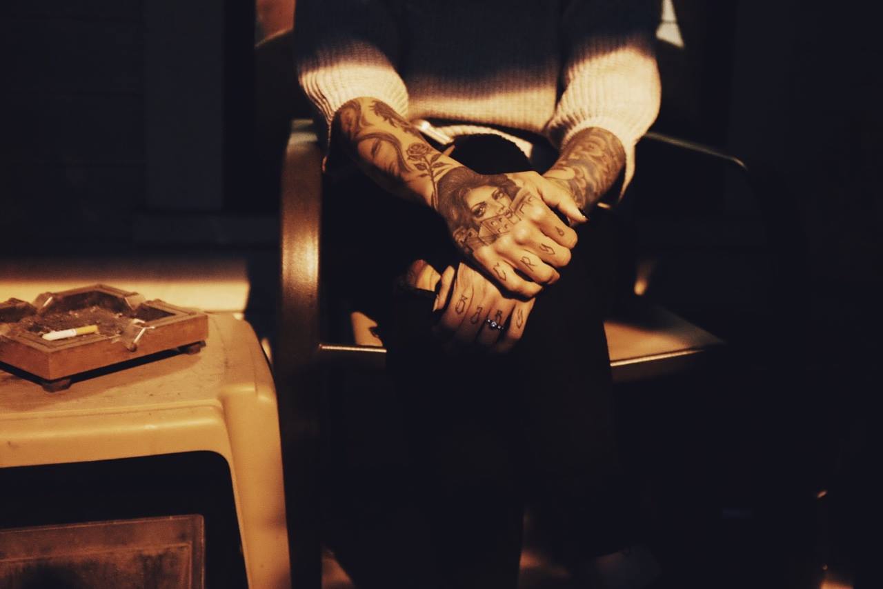 This is my other favorite snapshot from this year. Just a late summer evening on our front porch, hanging with friends, and the light coming onto the porch fell perfectly to highlight my friend Jessie Felix 's tattoos. - Anthony Ryan Tripoli