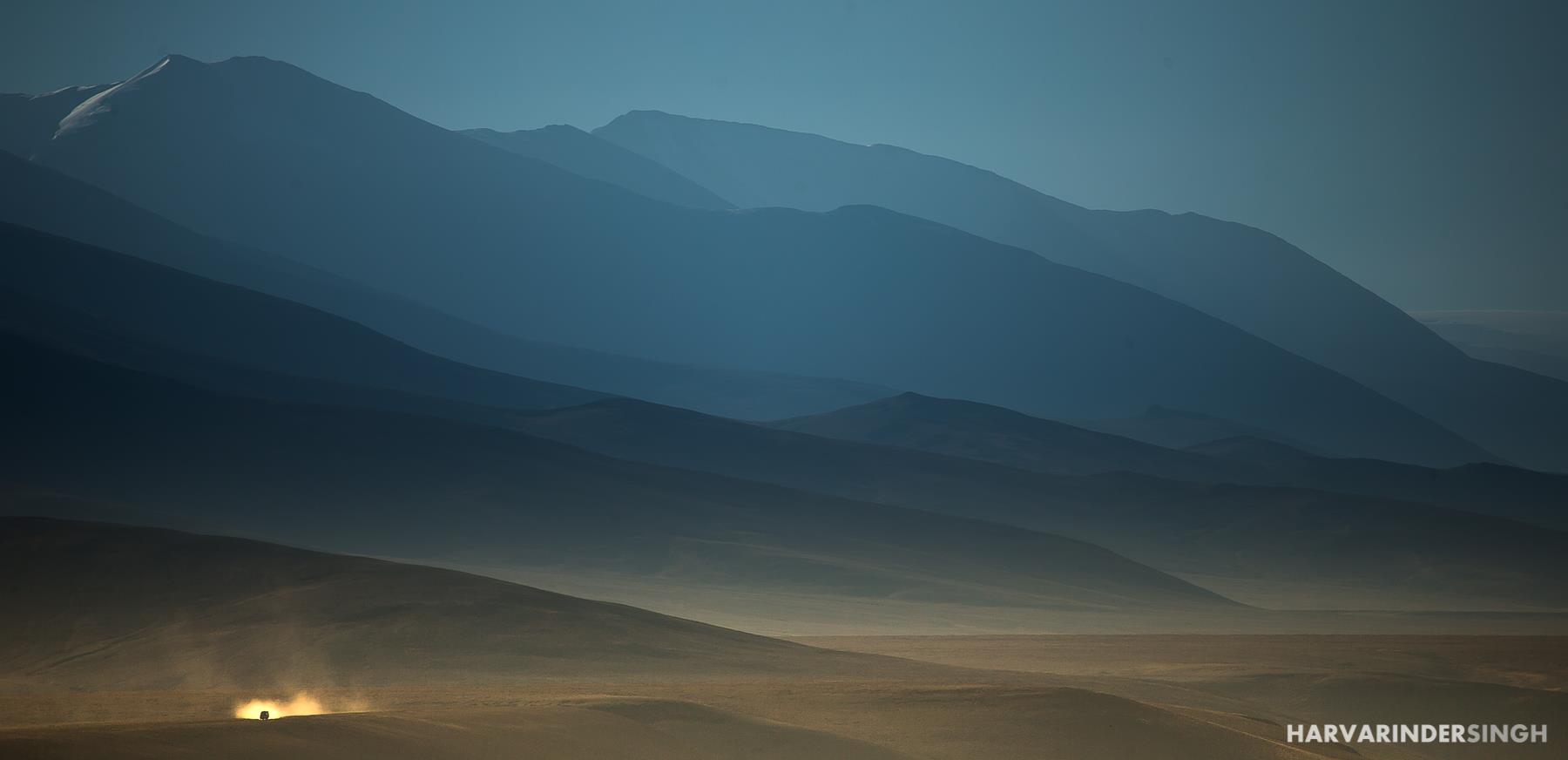 This is by far my favorite photo of the year 2016! I have been to Ladakh 4 times. This particular stretch is called the More Plains at 15,400 ft altitude. This 40 km of straight stretch at such high altitude makes you think how diverse our planet is. We woke up at 4 AM in minus 2 , crossed 2nd Highest Pass in the world at 6 AM at freezing minus 10 to witness More Plains Sunrise ! Just about reached in the middle of More Plains I saw an Indian Army Truck approaching towards us, the sheer size of the mountains at the back and the size of truck forces you to think how tiny we are in front of the Mother Nature! - Harvarinder Singh 