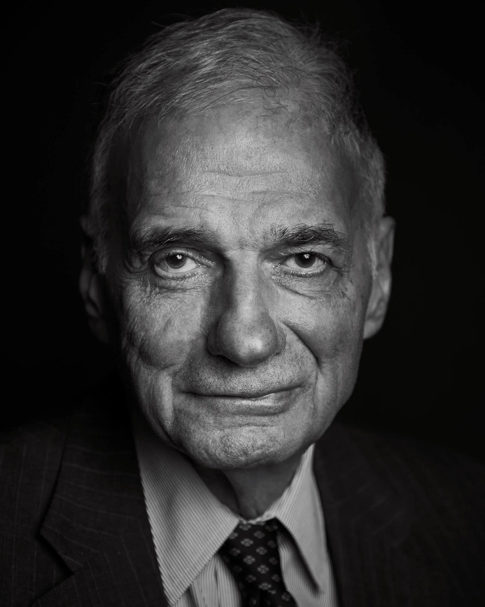 RALPH NADER I found out about three hours before taking this shot that Ralph Nader was in town, on tour for his latest book. I contacted the library and wrangled up an assistant. I had 45 minutes to setup and about three minutes to shoot. We did the shoot while the library was doing his introduction. I have such great respect and admiration for this man. His advocacy for automobile safety has saved more lives than we can possibly imagine. - Kevin Patrick Robbins 