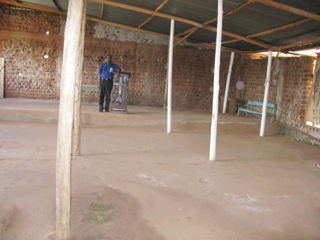 Pastor Luyinda and Church Roof 2.jpg