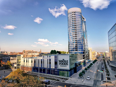 The $121 million 360 Market Square is a mixed-use development in downtown Indianapolis featuring 292 luxury apartment units and a Whole Foods Market. Flaherty & Collins was the project developer.