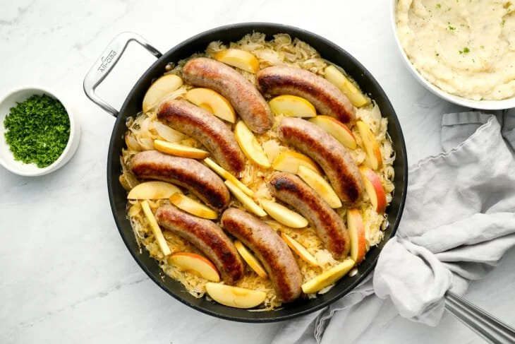 Bratwurst and Sauerkraut with Apples and Onion