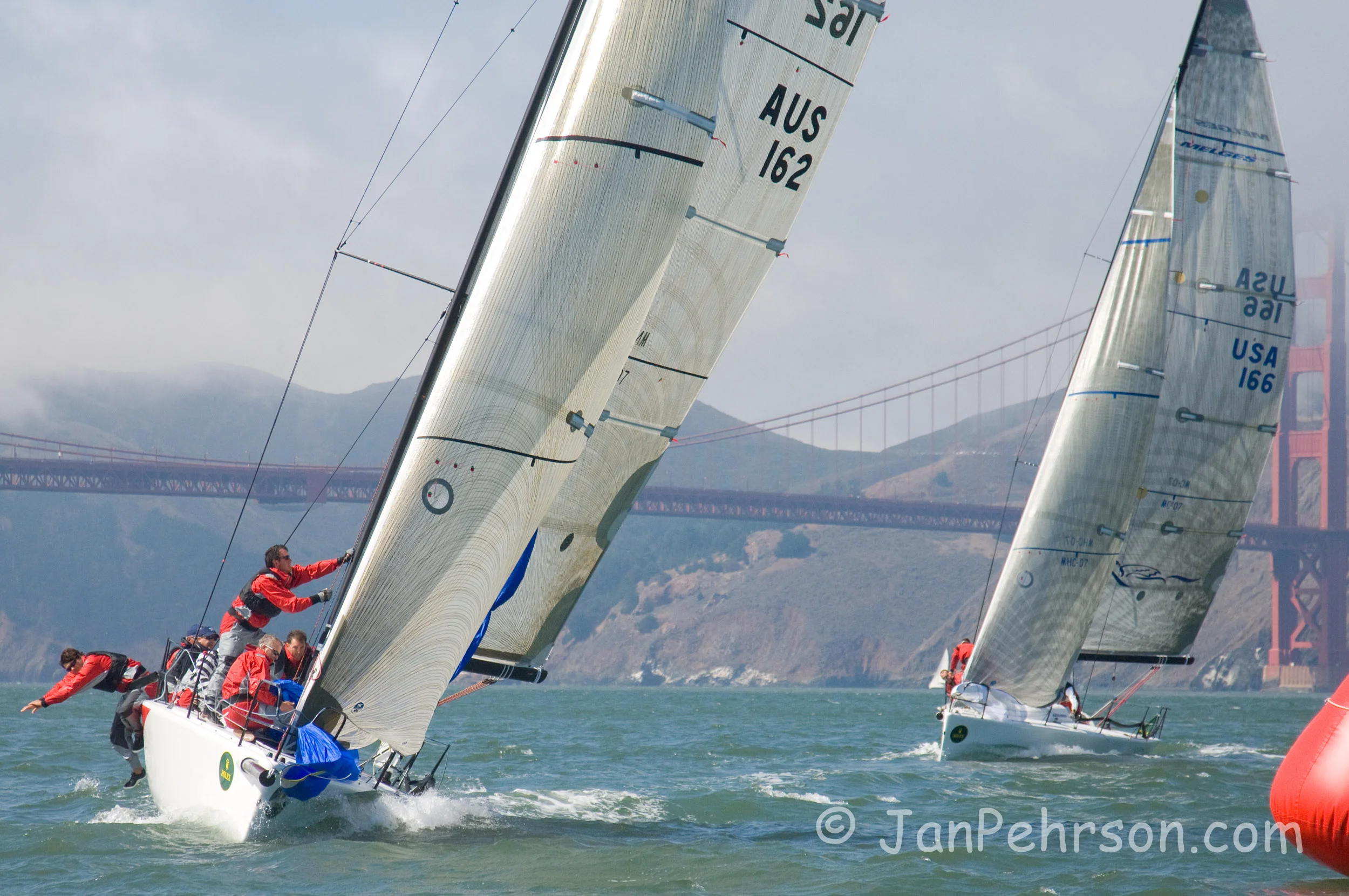 Rolex 2007 Big Boat Series San Francisco - Melges 32 - Southern Cross ( Richard Leslie) leads  Pegasus 32 (Philippe Kahn) at the weather mark near the Golden Gate Bridge. (02413)