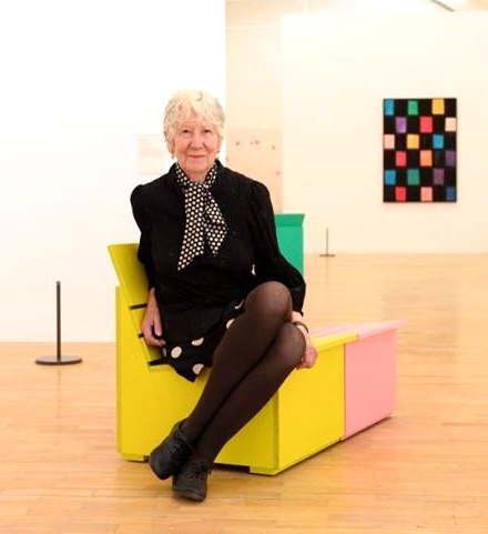 Mary Heilmann wearing silk polka-dot skirt and silk polka-dot scarf at her show at Whitechapel Gallery, London