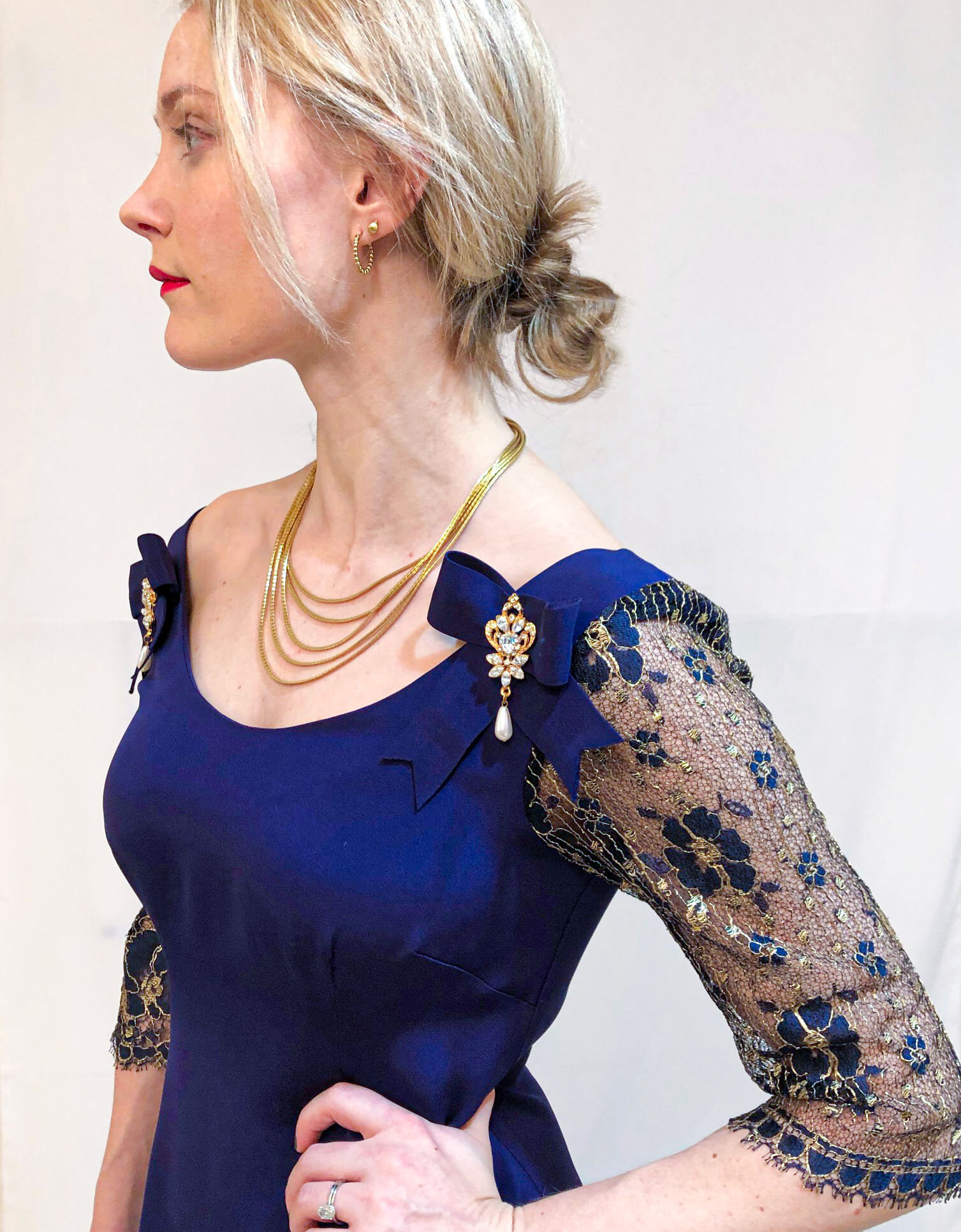  Blue 4-ply silk knee length sheath dress with lace sleeves and jewelry bow detail - 6-8 - $675. now $450. .  