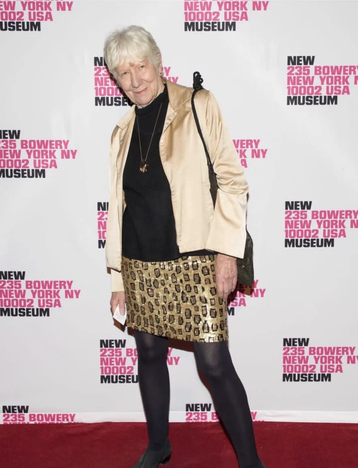  Mary Heilmann at her show  at 303 Gallery wearing sequin skirt, cotton jacket and black cotton skirt  